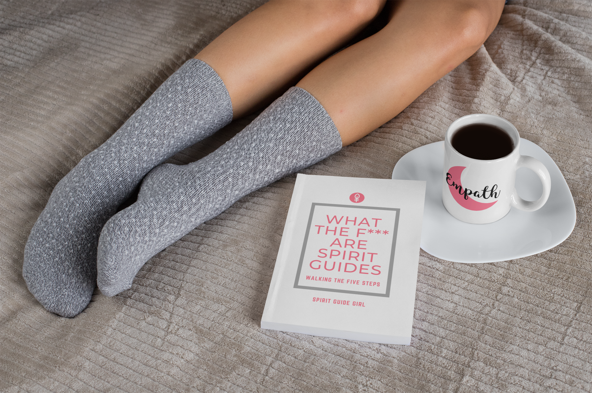 mockup-of-an-11-oz-mug-and-a-book-on-a-bed-28468.png