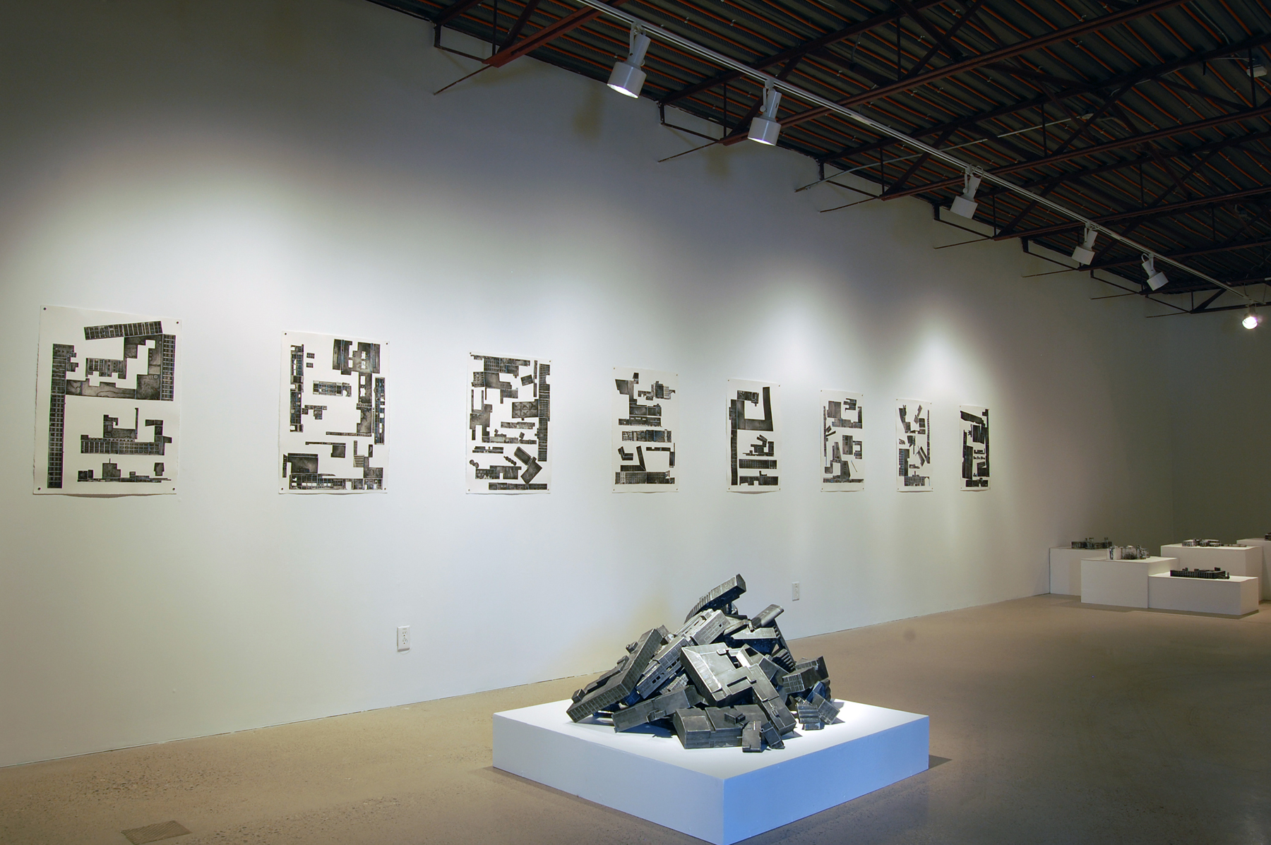 Boom Town (2007-2009) Modelled after former industrial buildings along Montreal’s Lachine Canal, Boom Town is an installation of print-based sculptures that considers the possibilities after industrial obsolescence. Meticulously rende
