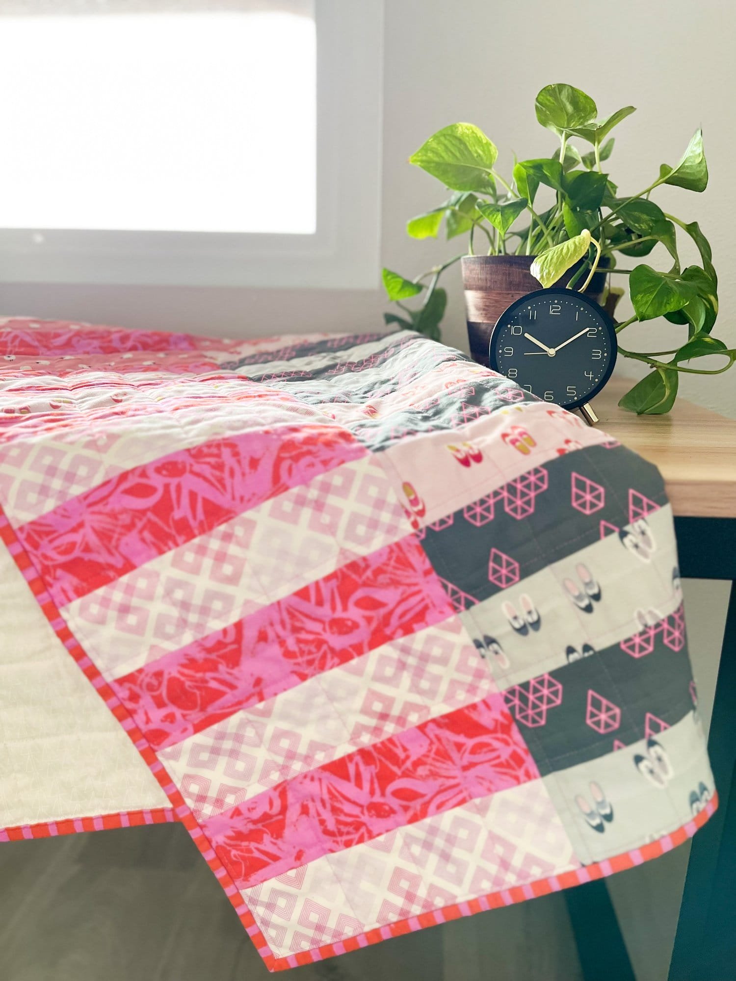 Village Fete Baby Quilt in Pink