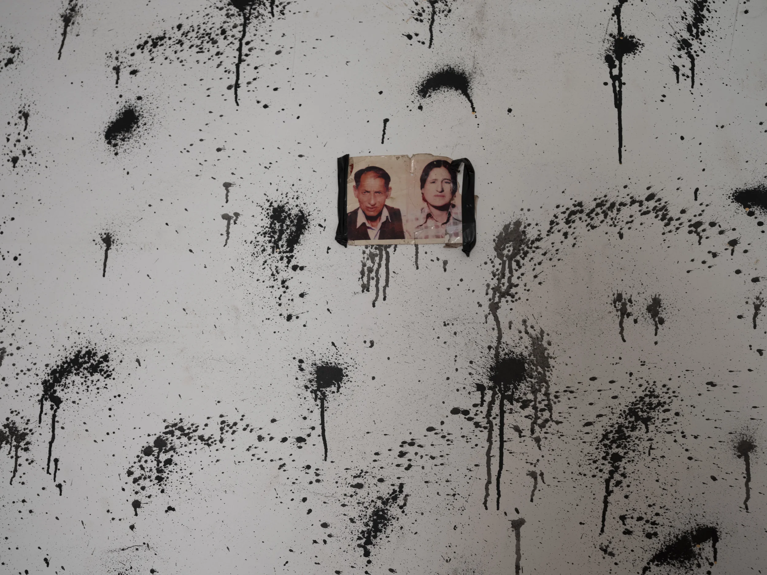 A very typical interior wall decoration of a Roma family home: memories of the ancestors hang on the wall, however there is not enough money to buy a frame.
