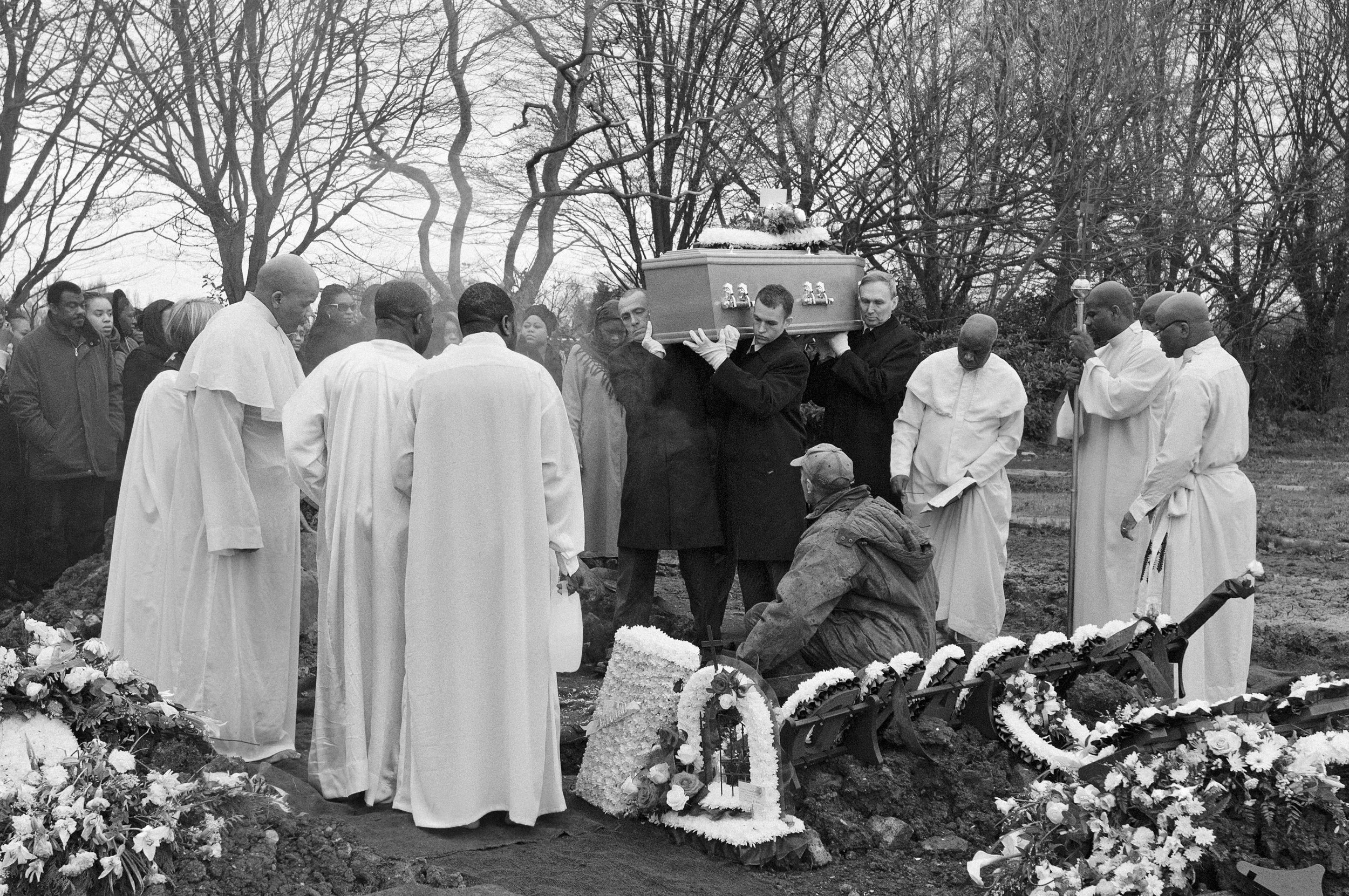 The body of Michael Ayotunde Dosunmu, the 15-year-old boy who was shot in his bedroom in Peckham on February 6th, is carried to his grave. He is one of the victims in the latest series of shootings predominantly taking place in South London. Once