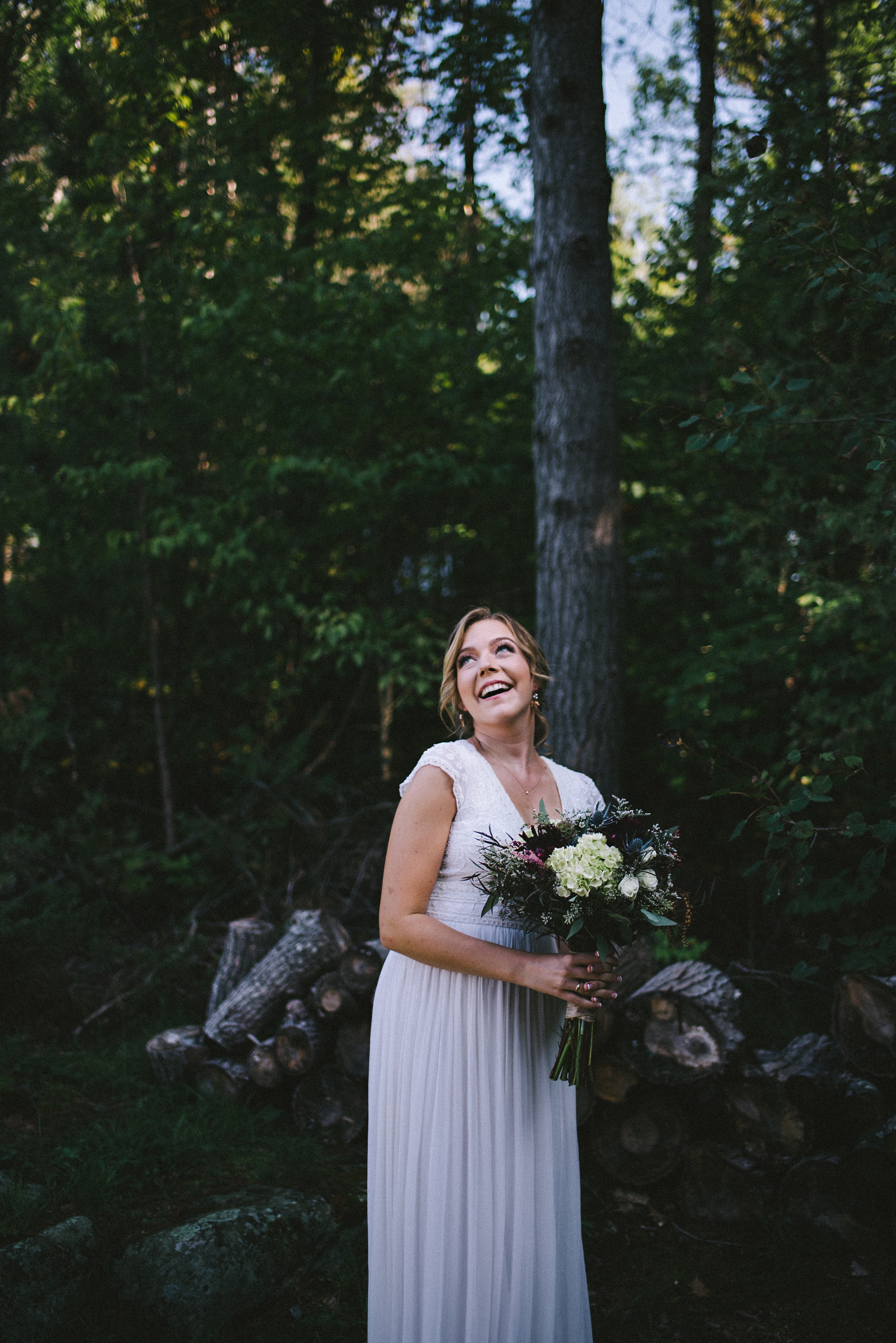 Happy boho bride at camp wedding in Parry Sound