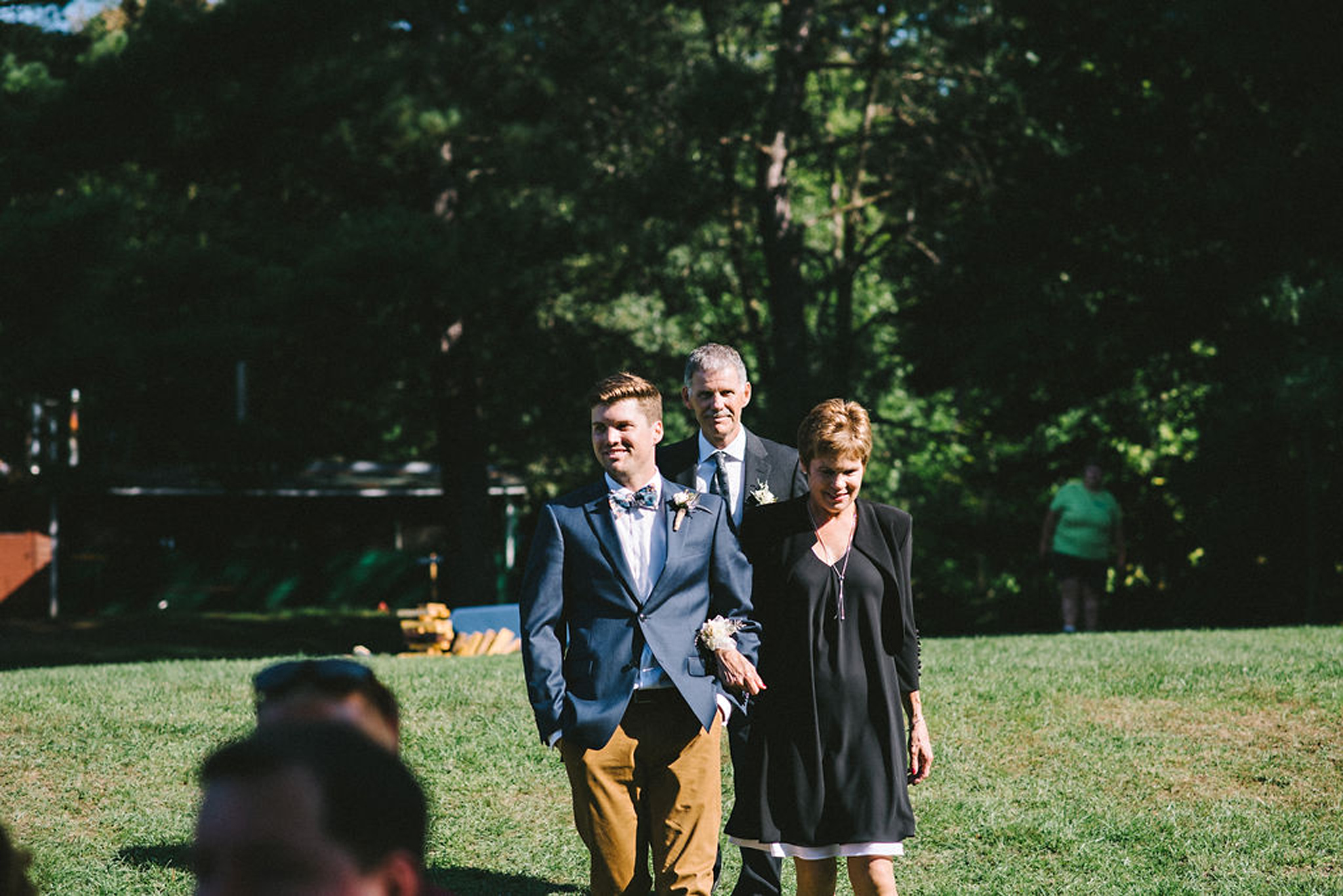 Groom arriving at Parry Sound camp wedding ceremony by lake