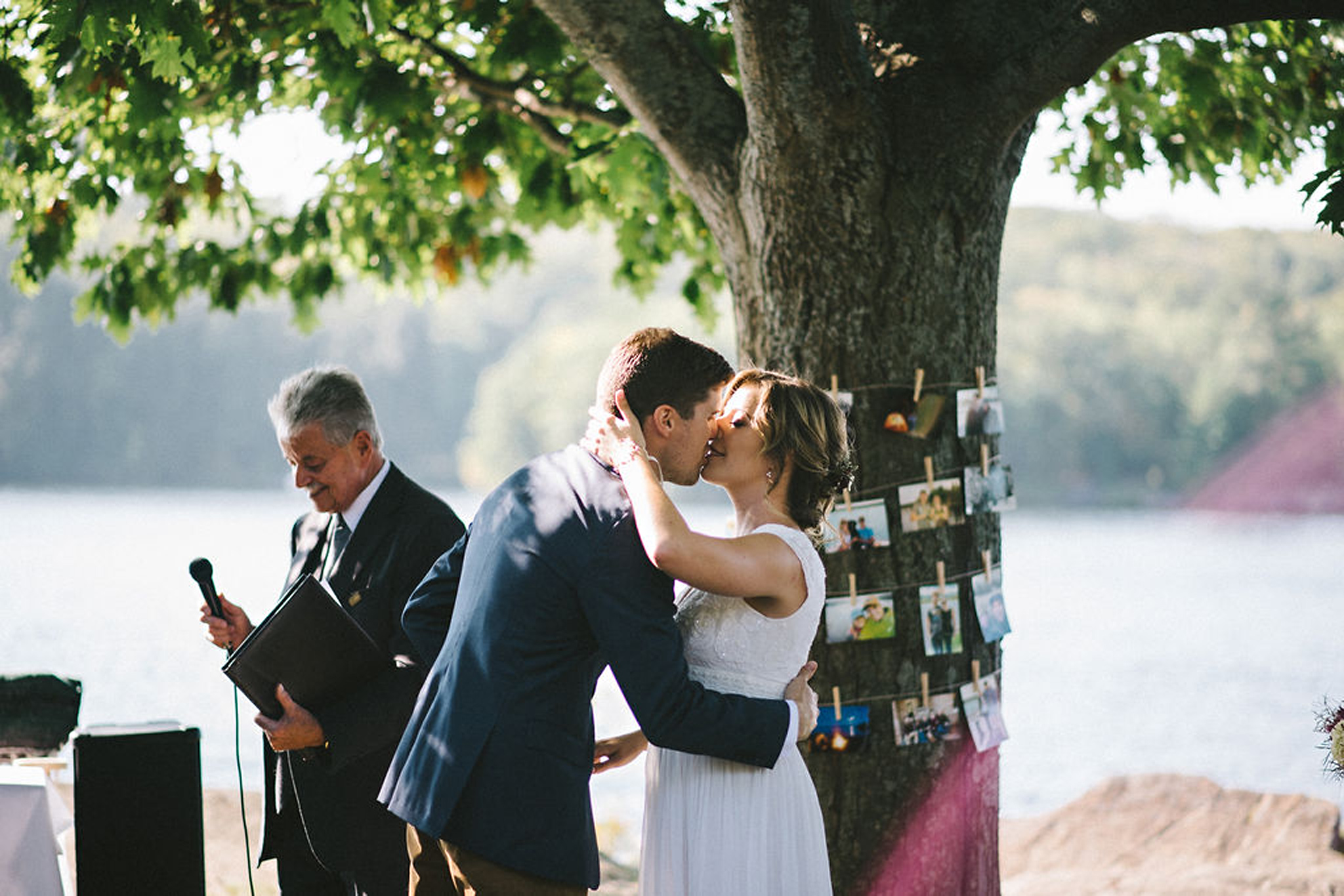 First kiss during lakeside Parry Sound camp wedding
