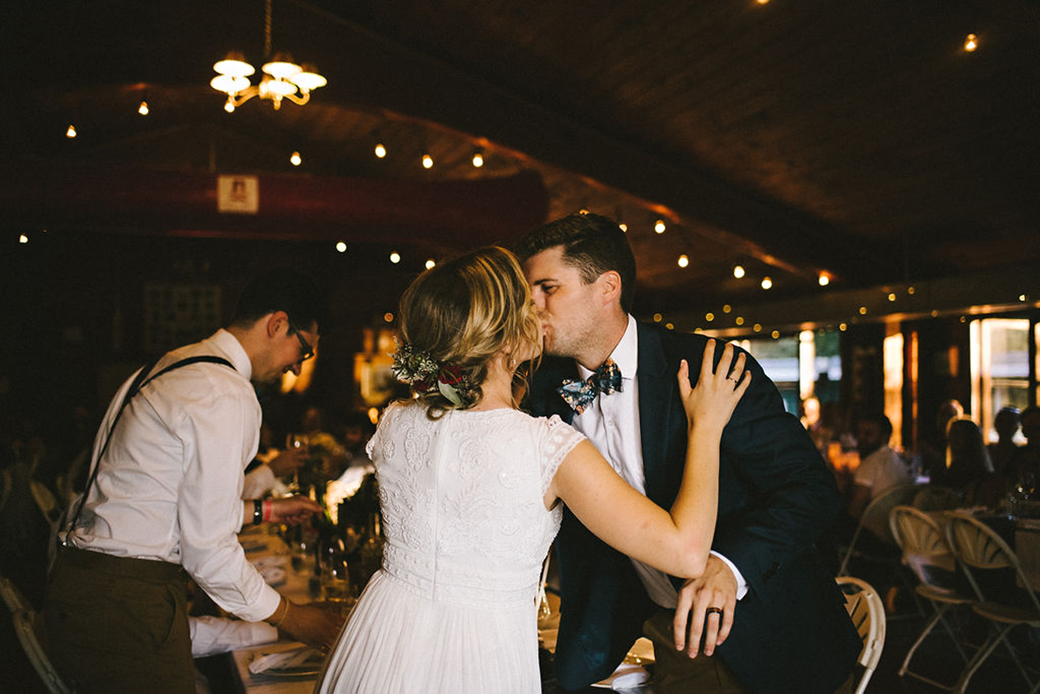 Bride and Groom kiss at Parry Sound camp wedding reception