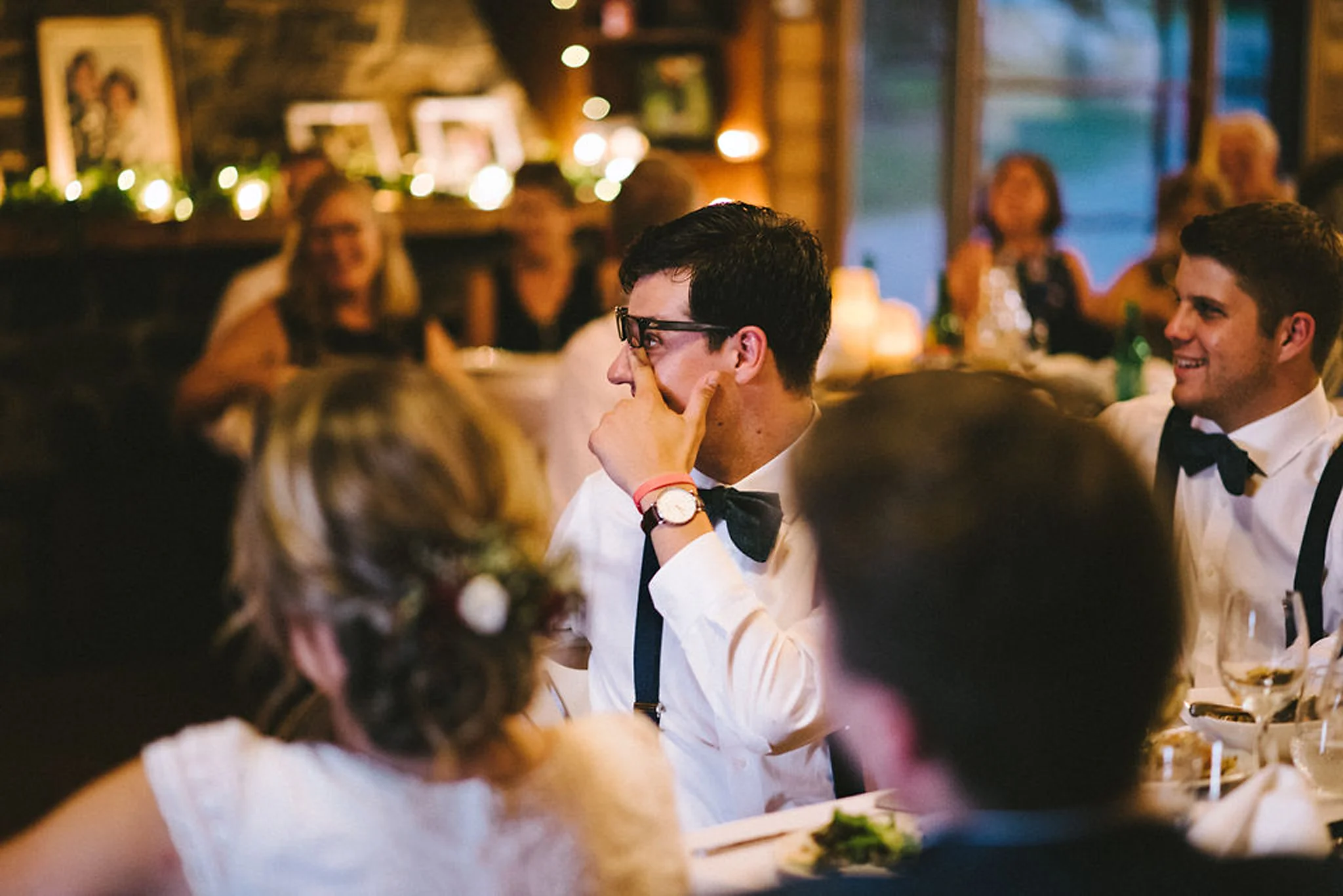 Emotional groomsmen during speeches at Parry Sound camp wedding