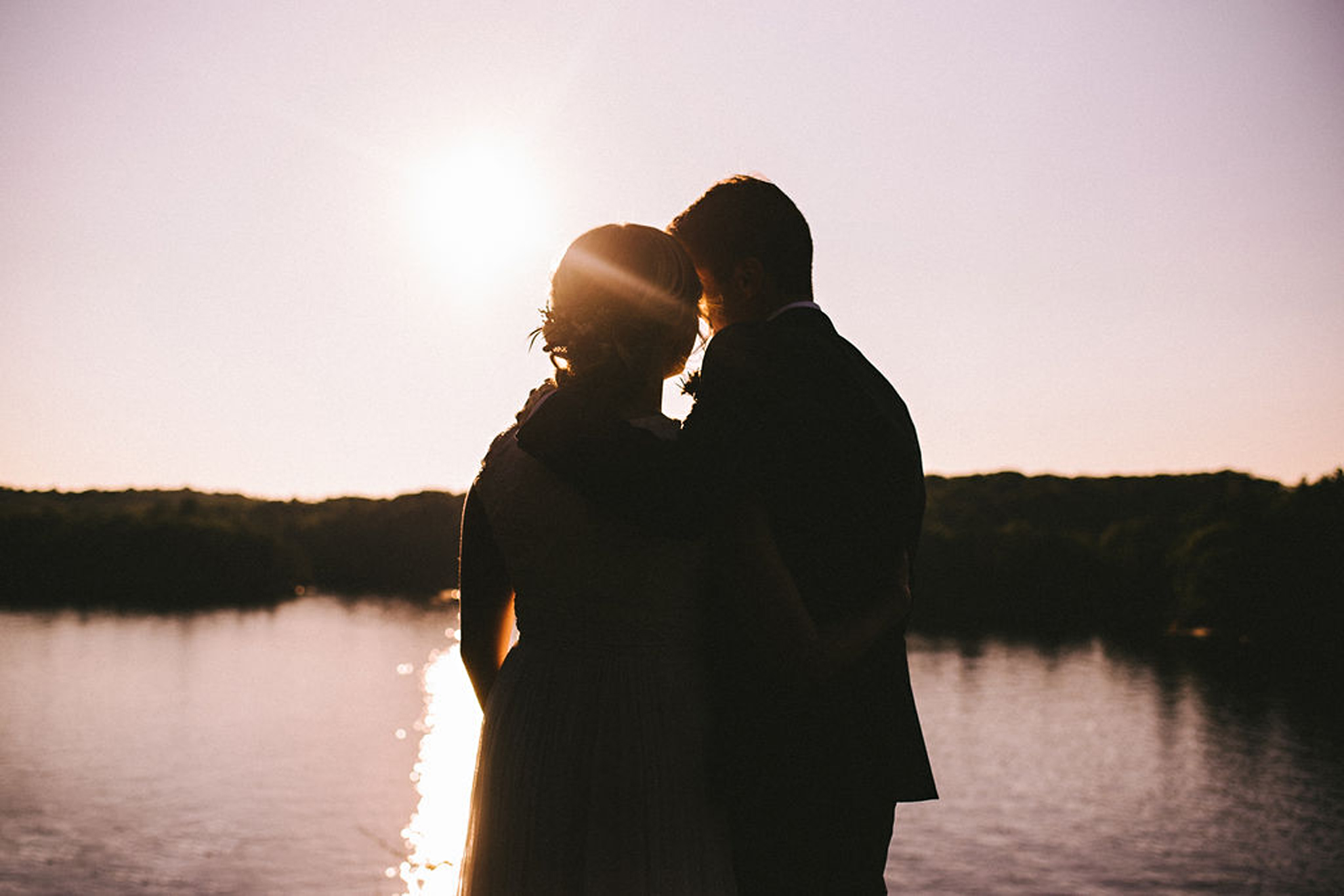 Moody couple portrait during golden hour at Parry Sound camp wed