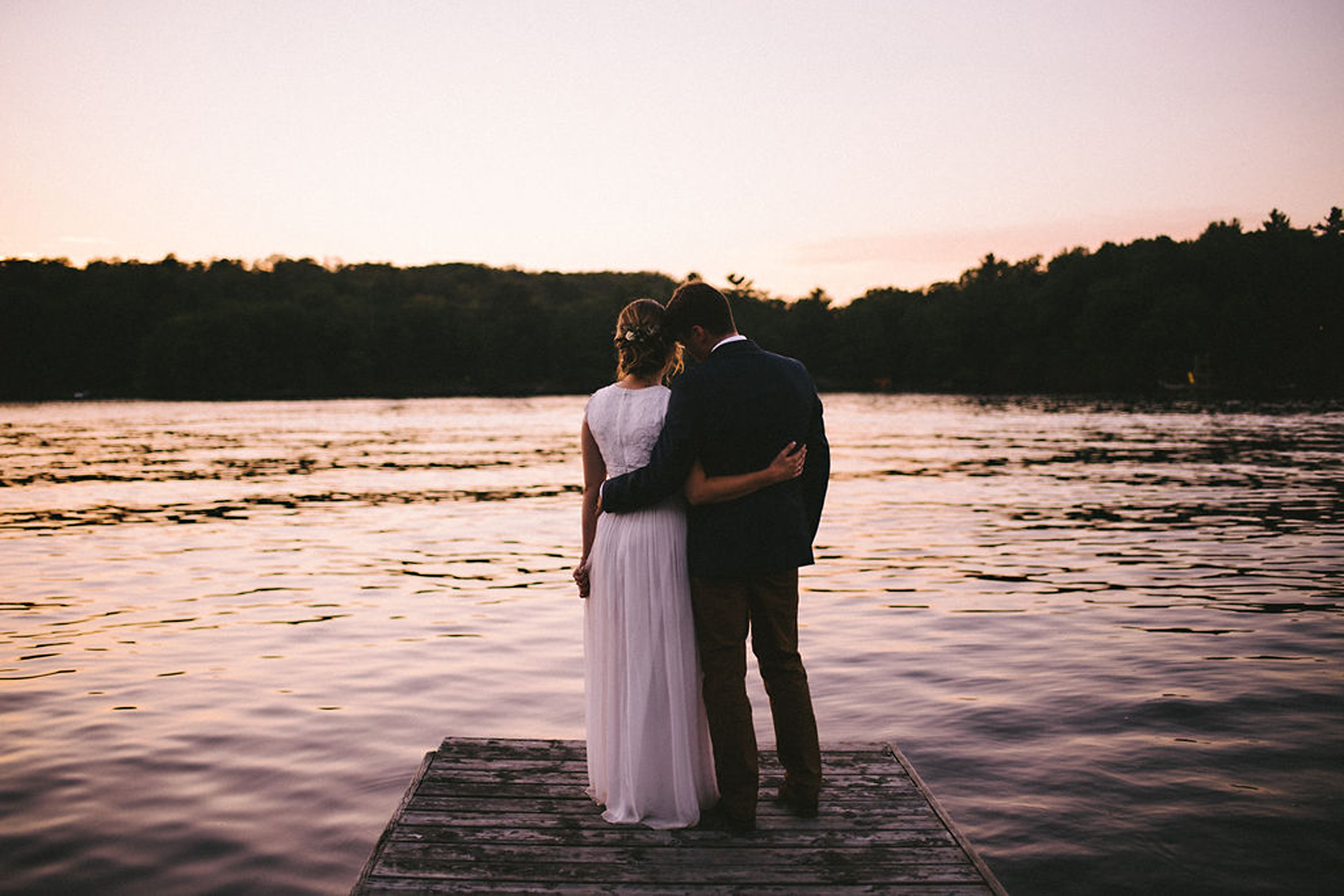 Golden hour portraits of couple at Parry Sound camp wedding