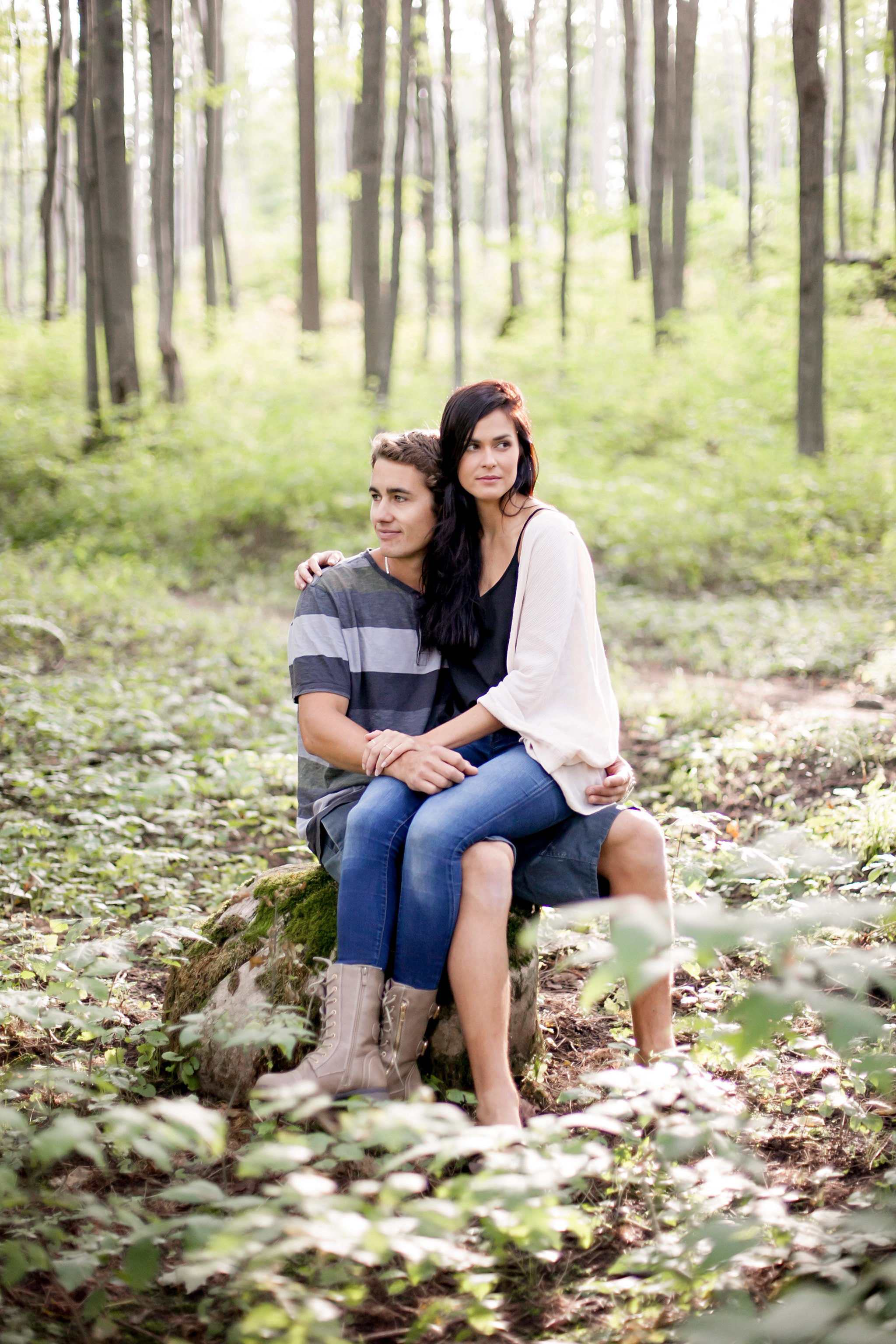 cozy couple in the forest during engagement session at castle gl
