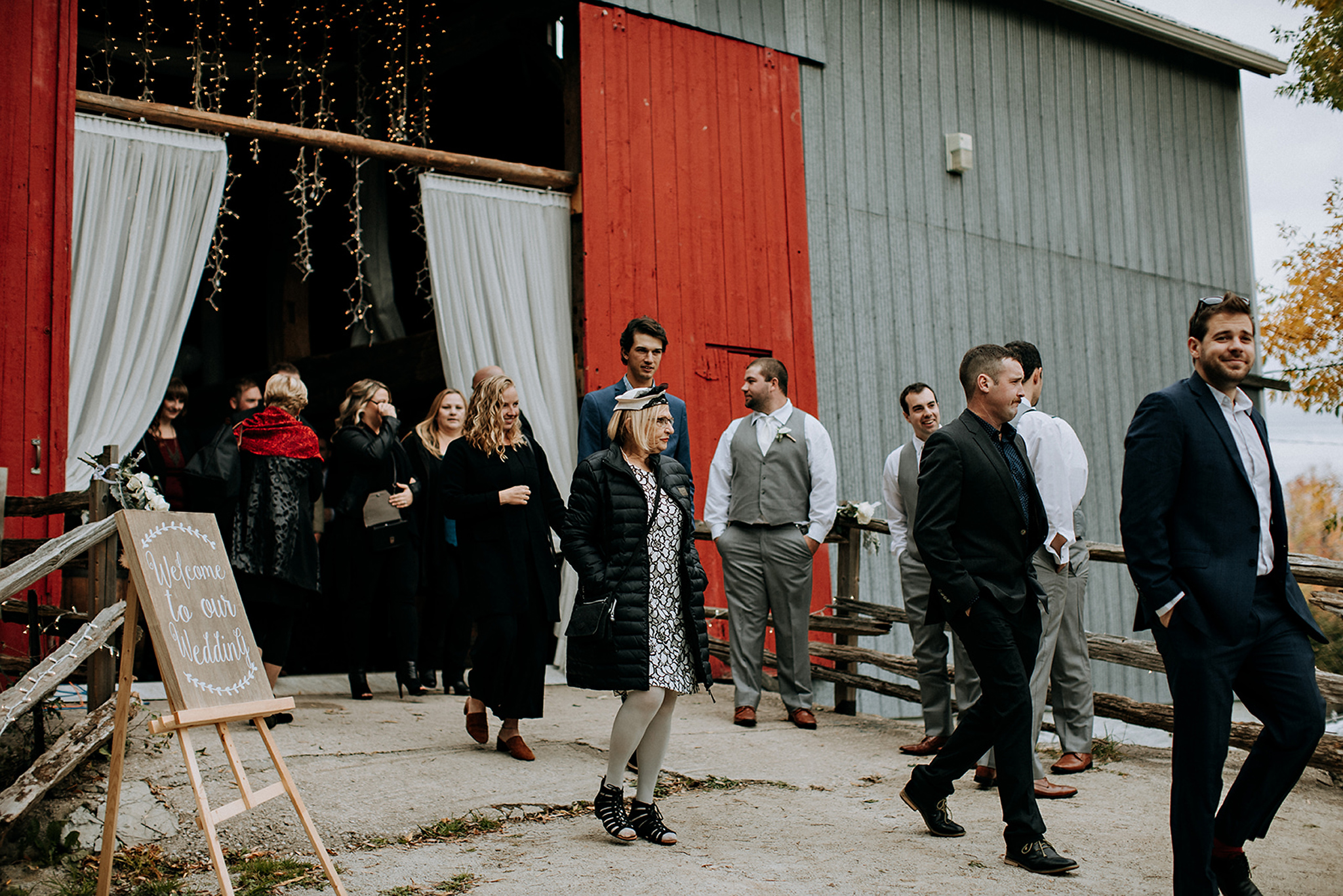 guests head to outdoor ceremony at meaford barn wedding