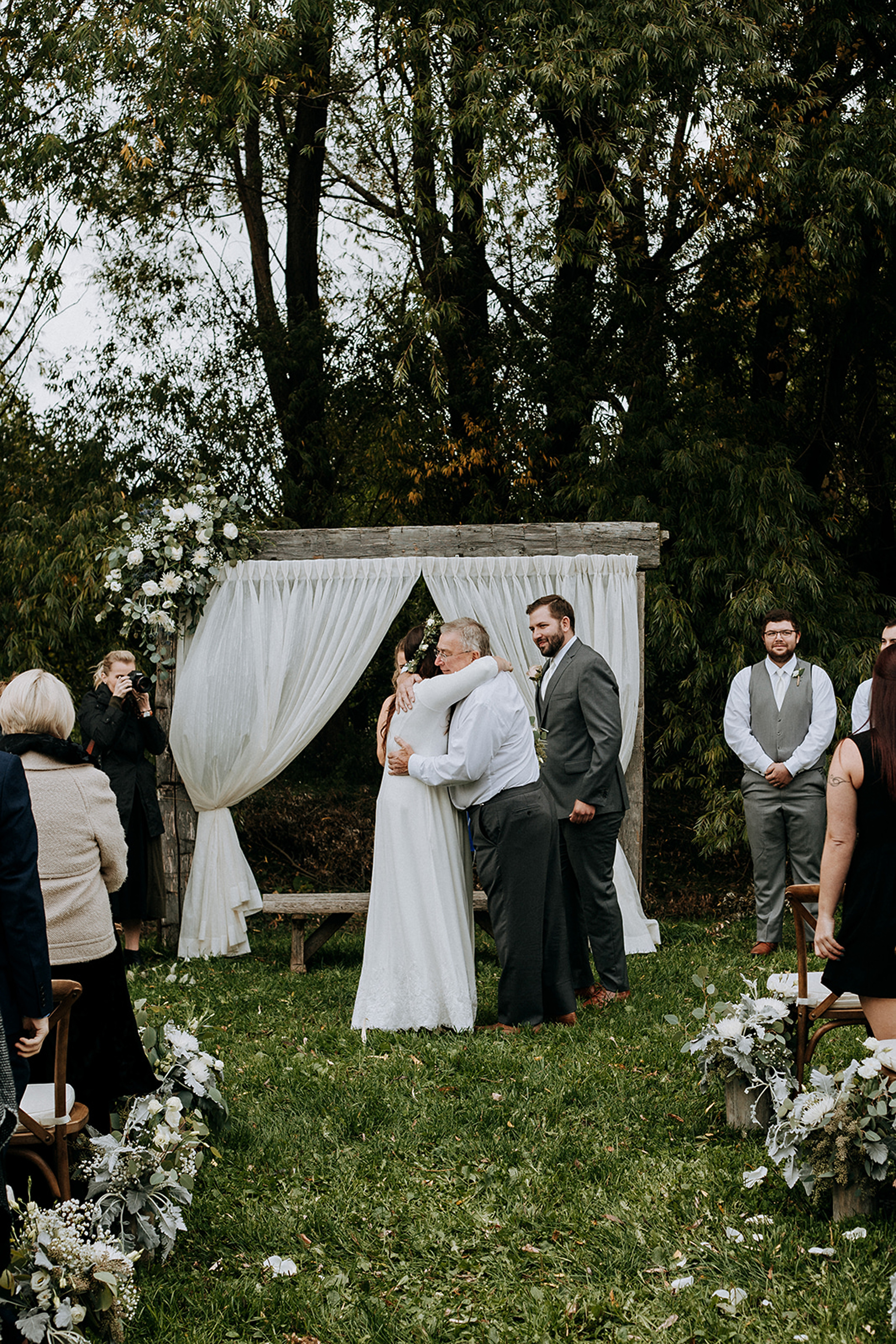 bride hugs father at outdoor cermeony in meaford