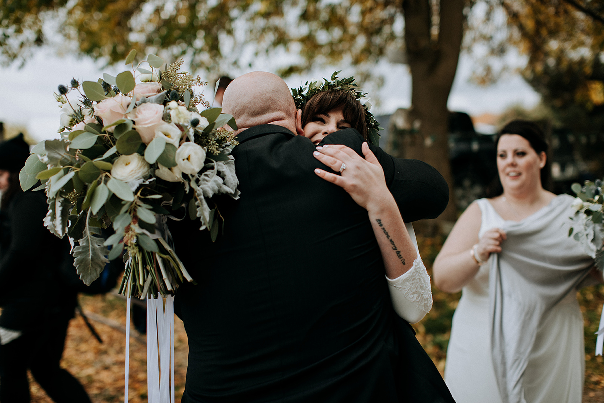 congratulatory hugs after outdoor wedding ceremony in meaford