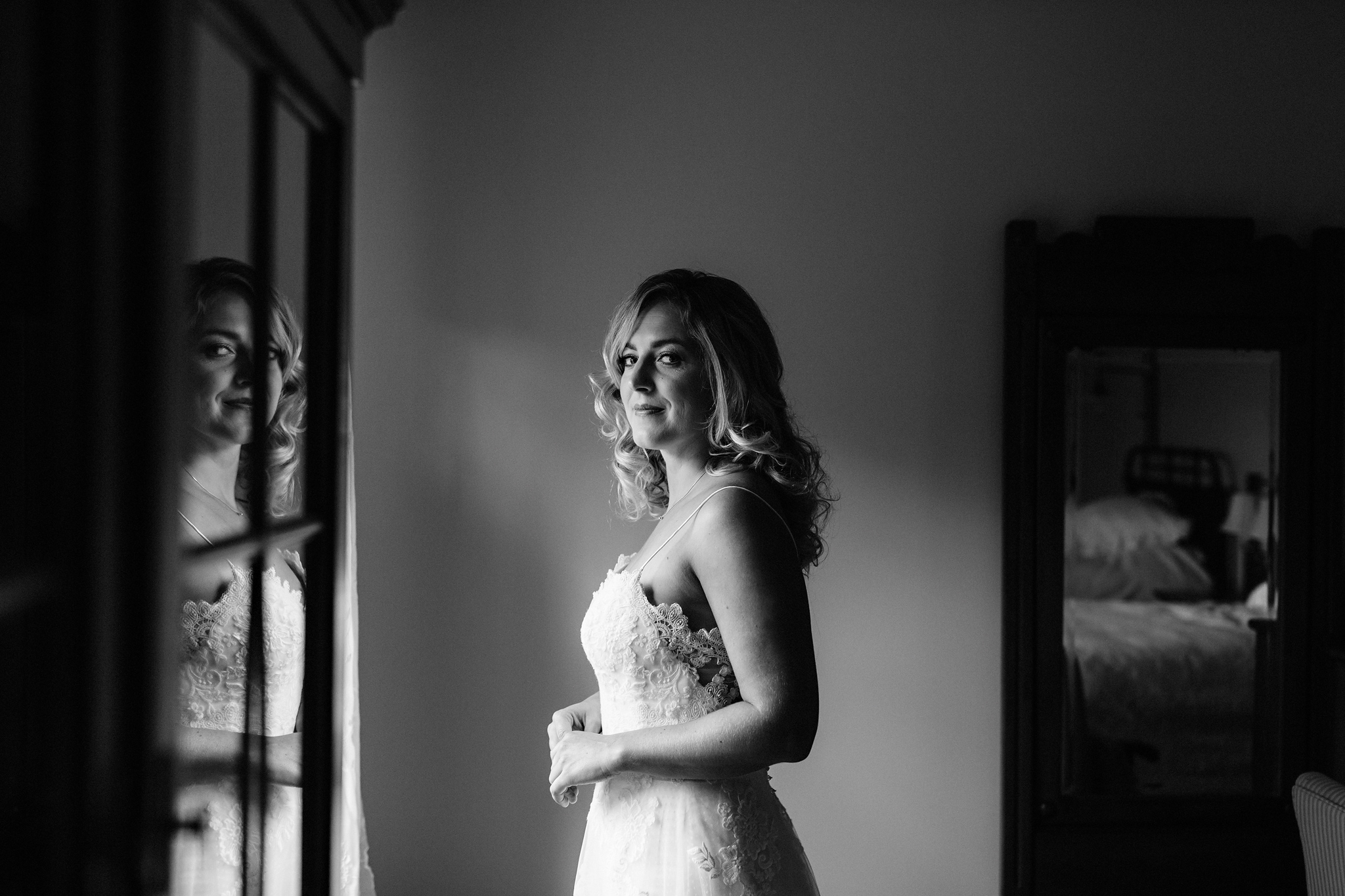 Bride and her reflection at the bnb at Coffin Ridge Boutique Win