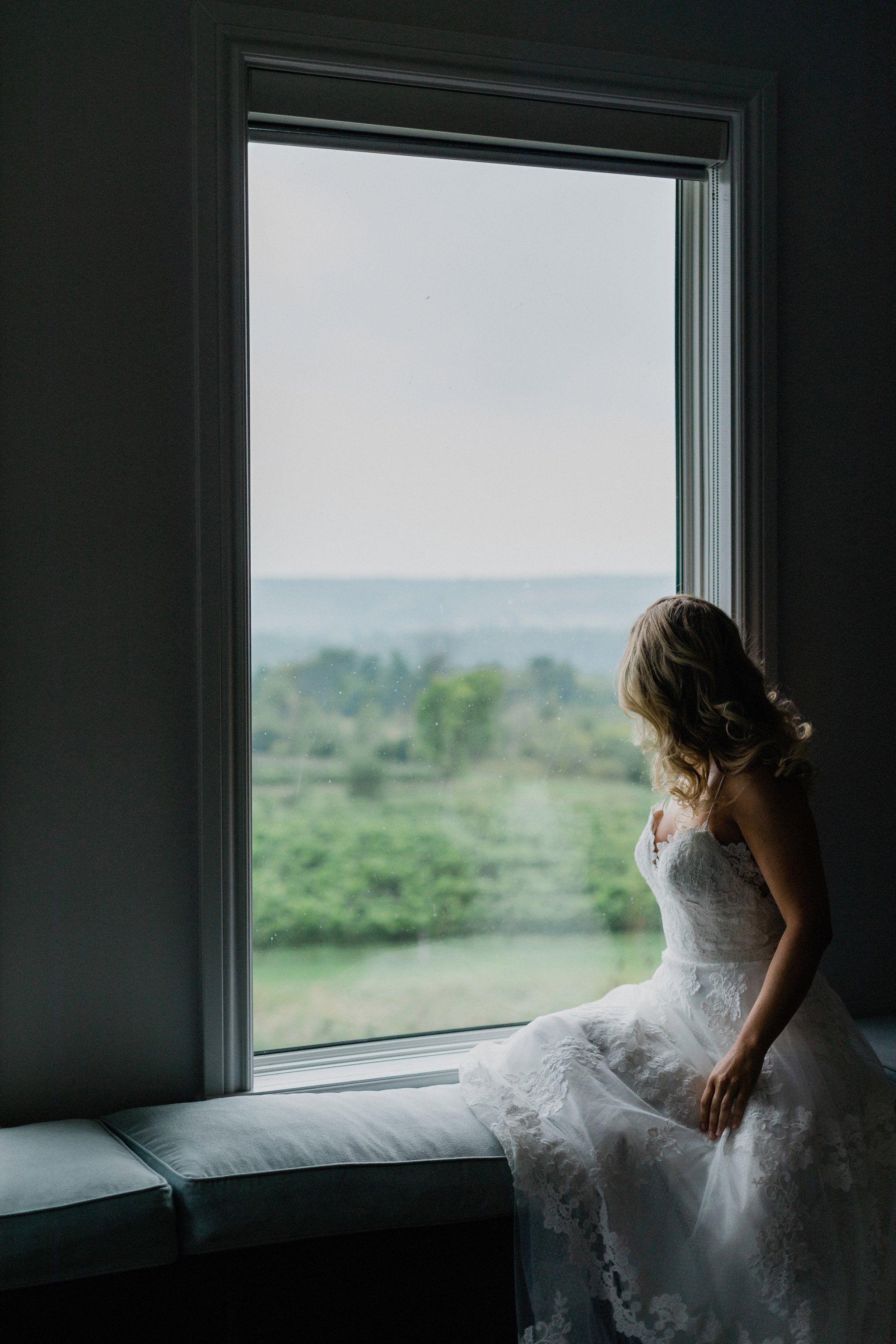 Bride looking out at the coffin ridge vineyard overlooking georg