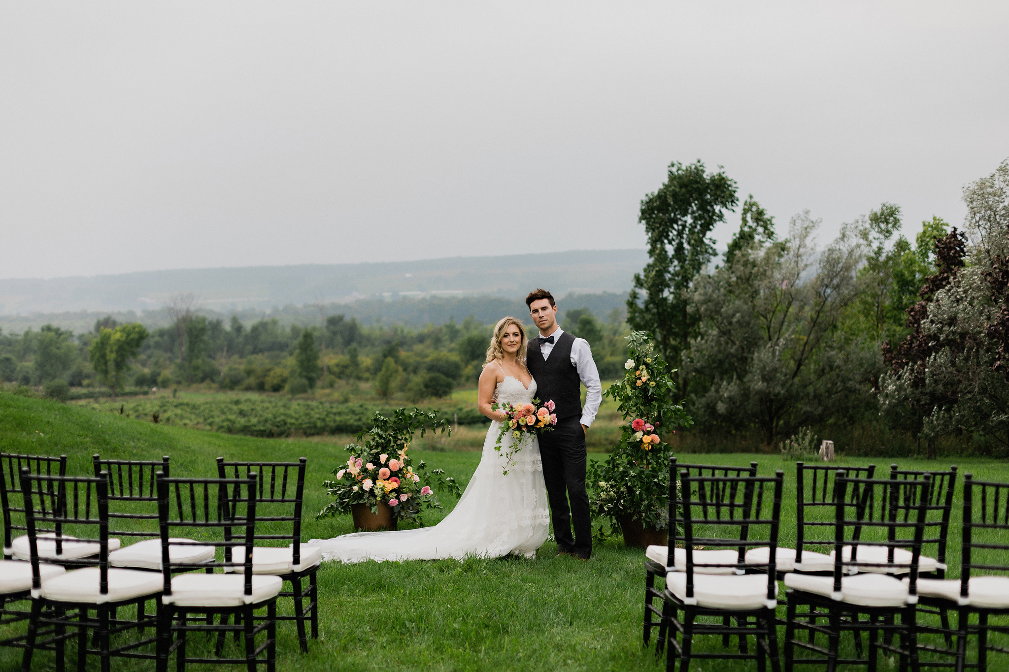 Bridge and groom at ceremony site with sweeping landscape at Cof
