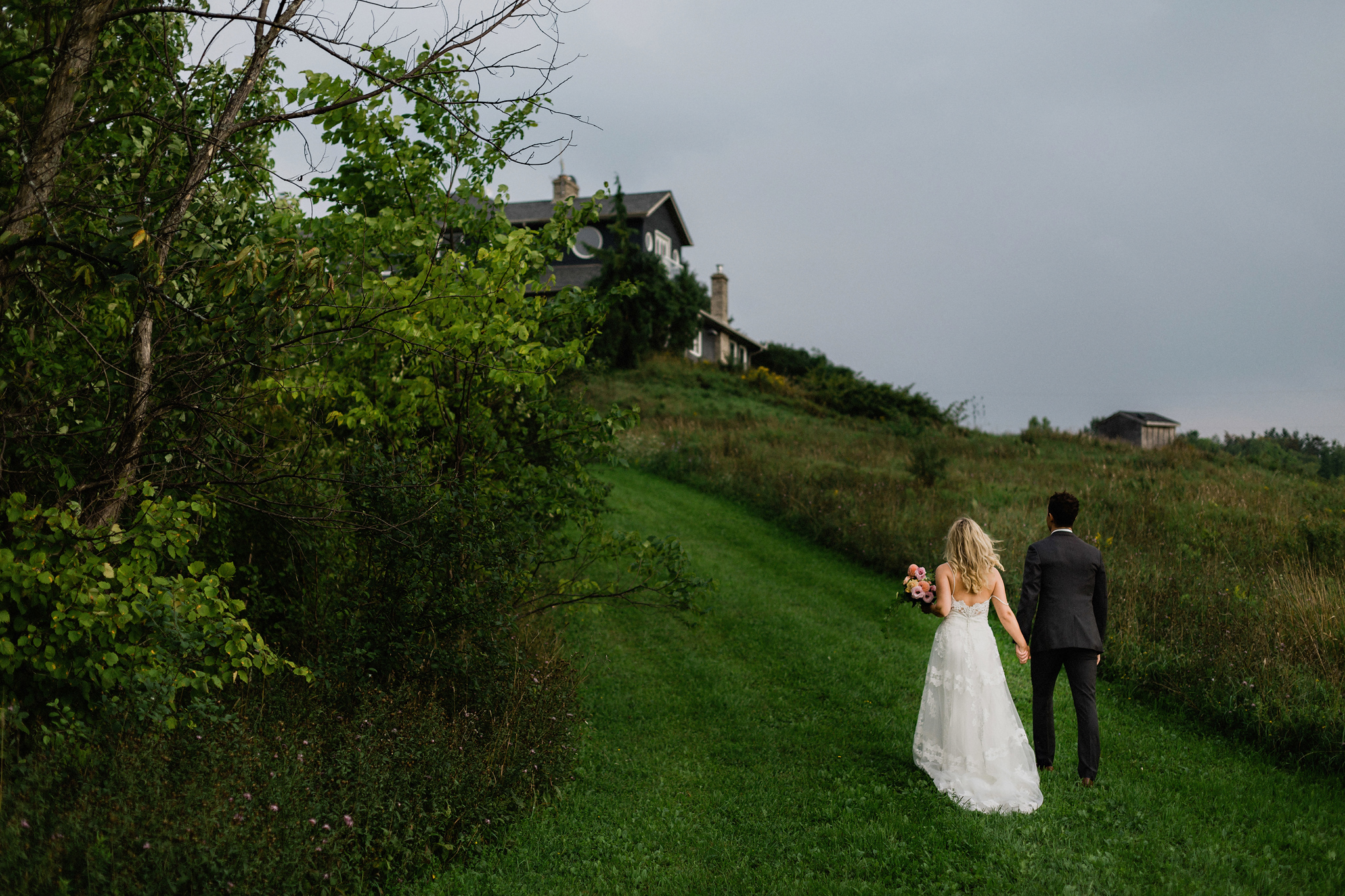 Couple head back to bnb at Coffin Ridge Boutique Winery wedding 