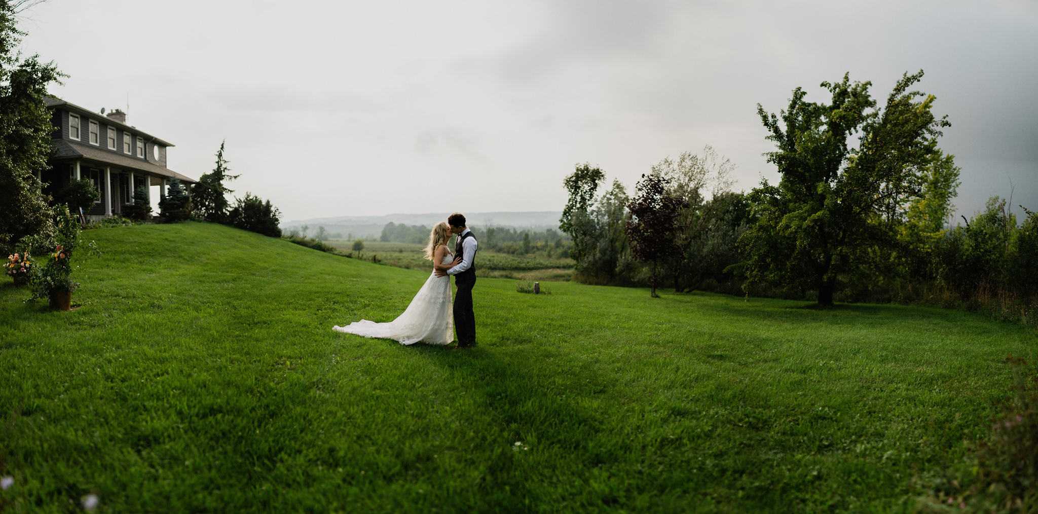 Bride and groom kiss at Coffin Ridge Boutique Winery wedding ven