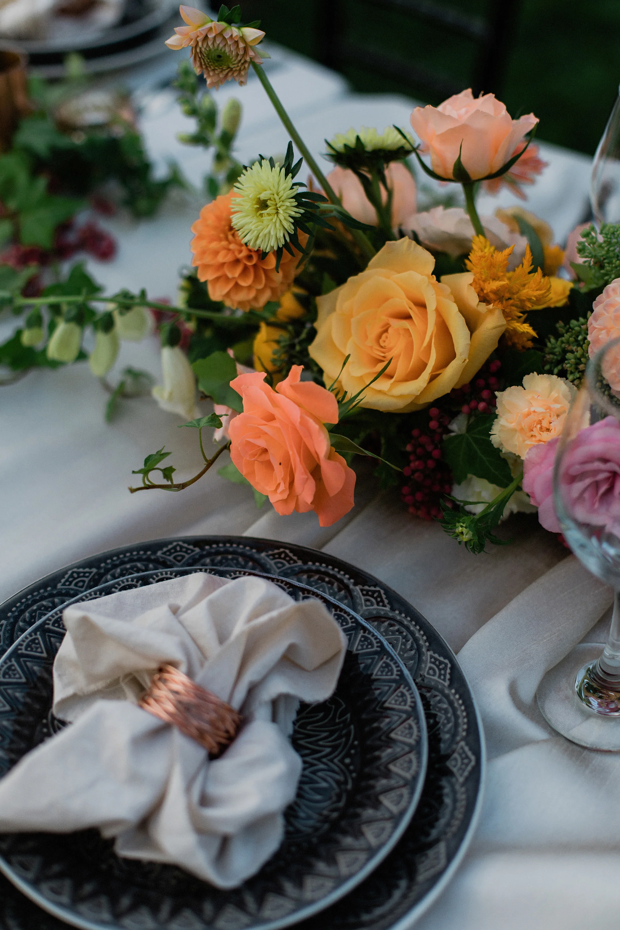 Coral toned with dahlias floral centrepiece with grey and copper