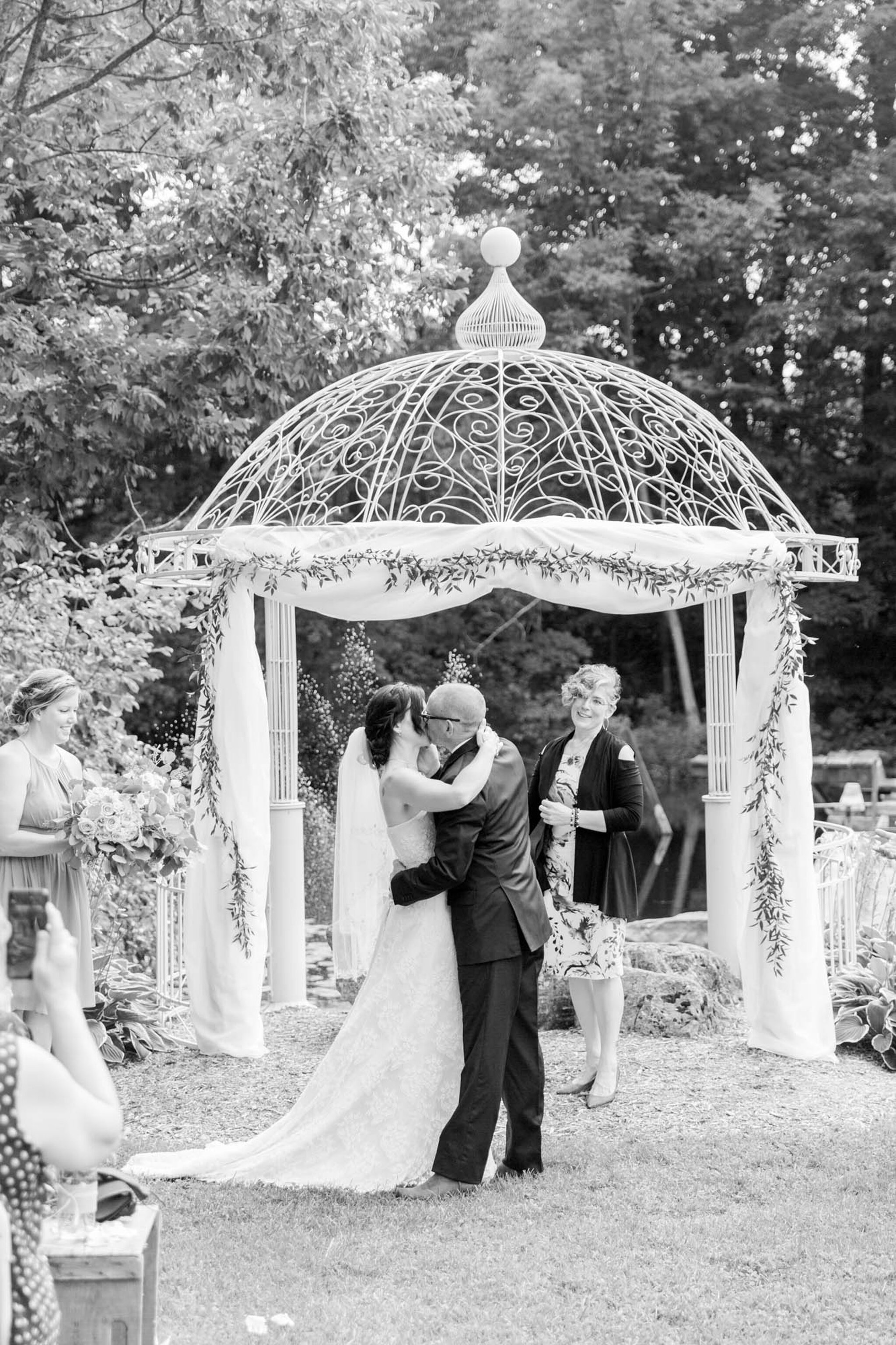 Wedding Ceremony first kiss at Walters Falls Inn and Spa