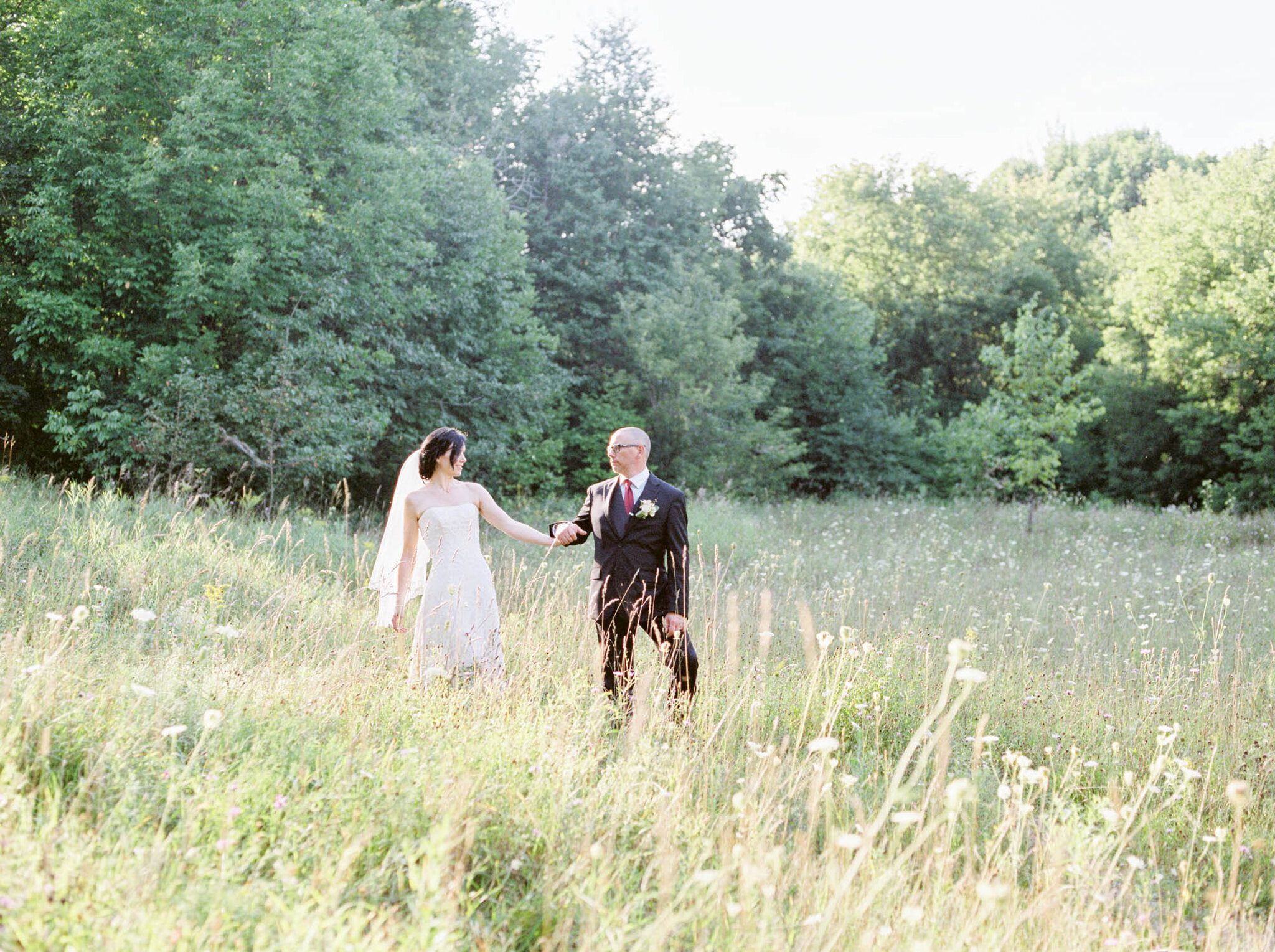 Wedding portraits in the field at Walters Falls Inn and Spa