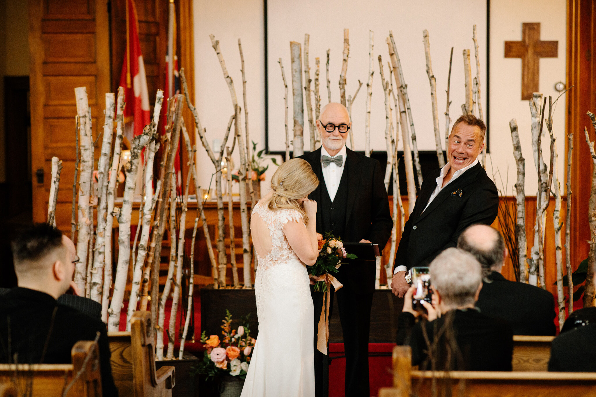 Having a laugh during intimate winter wedding ceremony in Thornb