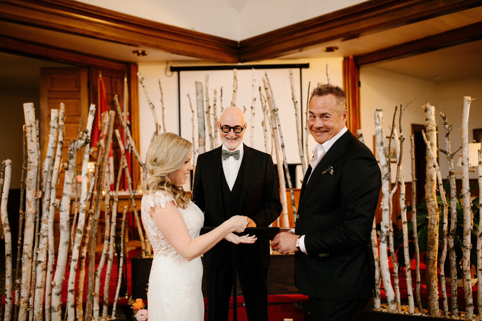 Exchanging rings at humourous intimate thornbury winter wedding