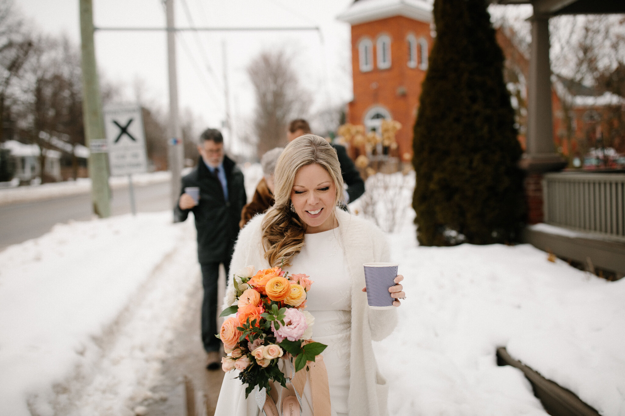 Bride with coral bouquet at winter wedding in thornbury