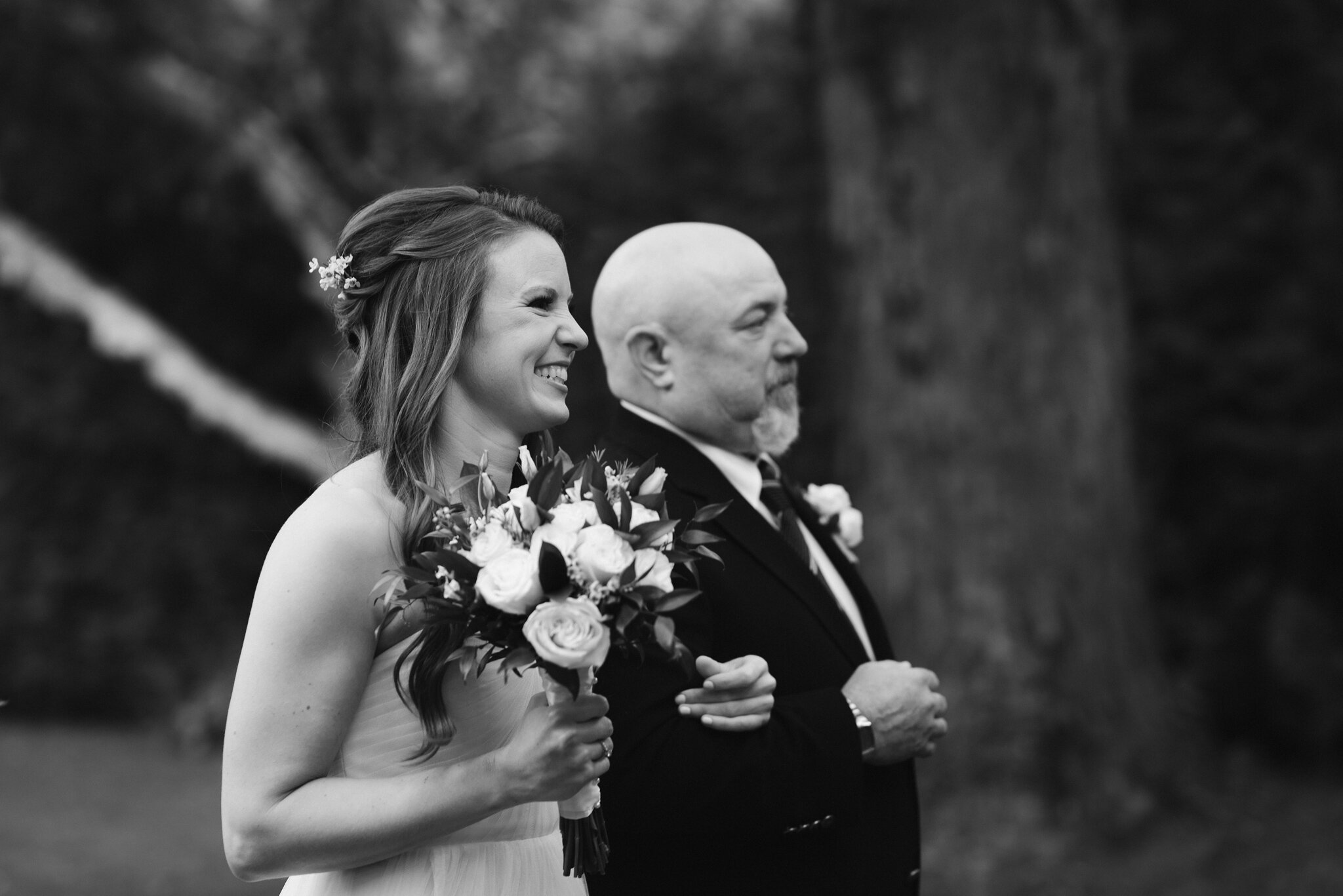 bride walks down the aisle with her father at backyard georgian 