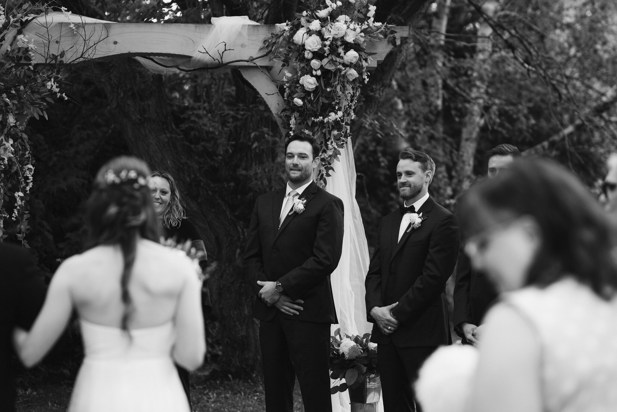 groom watches bride walk down aisle at backyard georgian bay wed