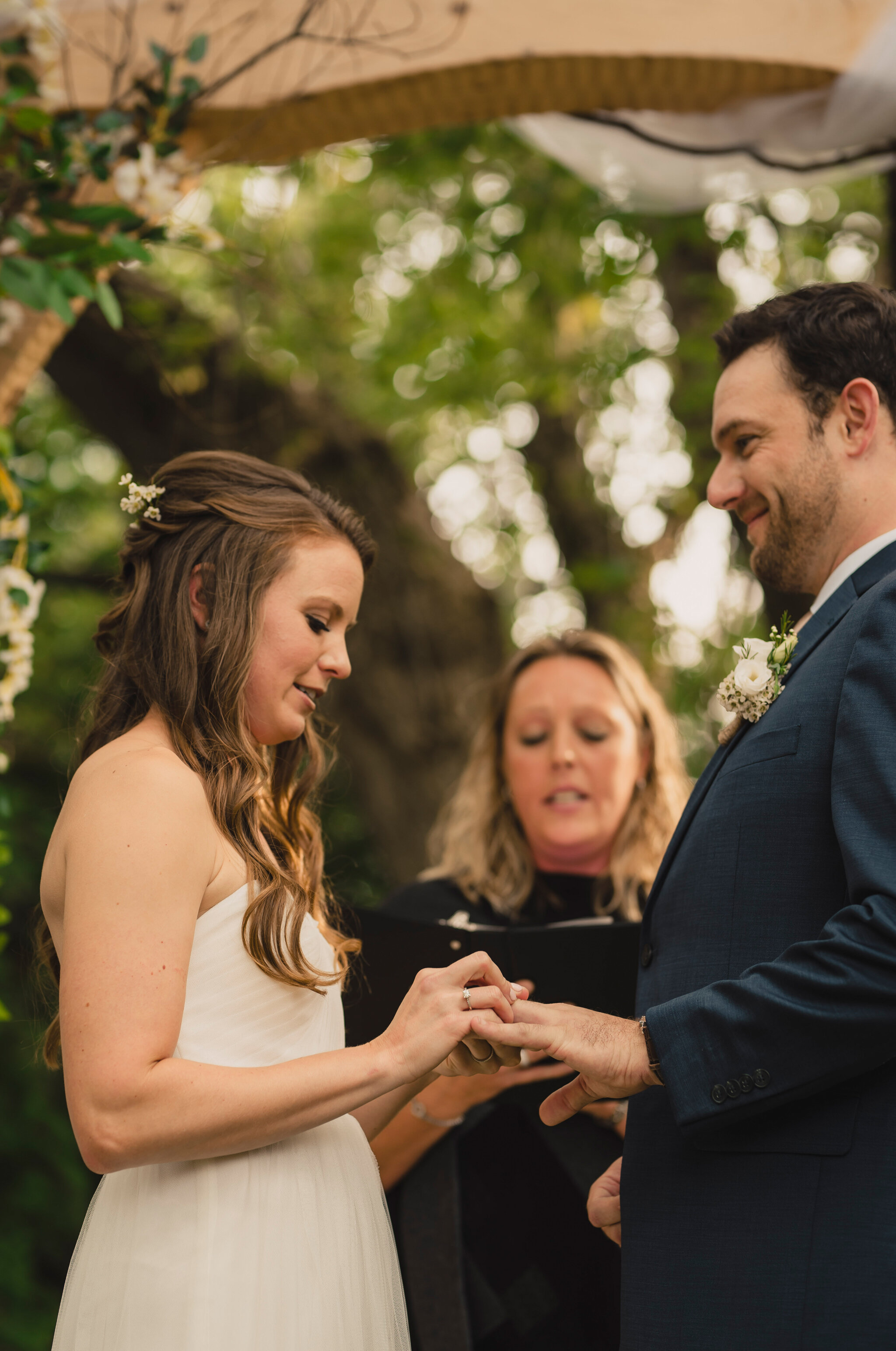 exchanging rings at intimate backyard south georgian bay wedding