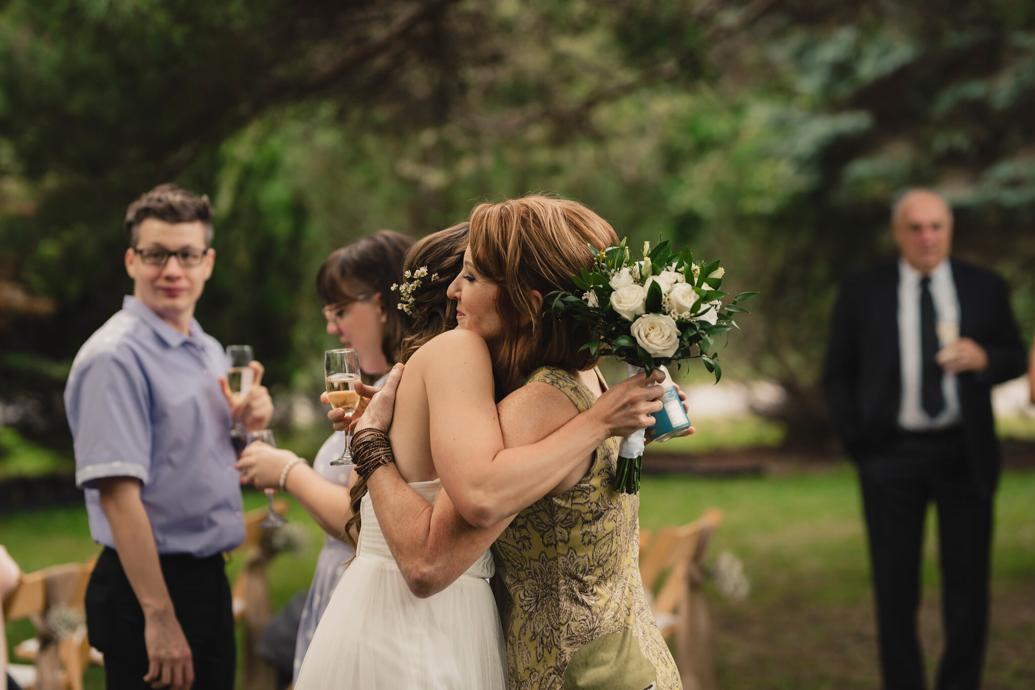 bride hugging guests at intimate backyard wedding in south georg