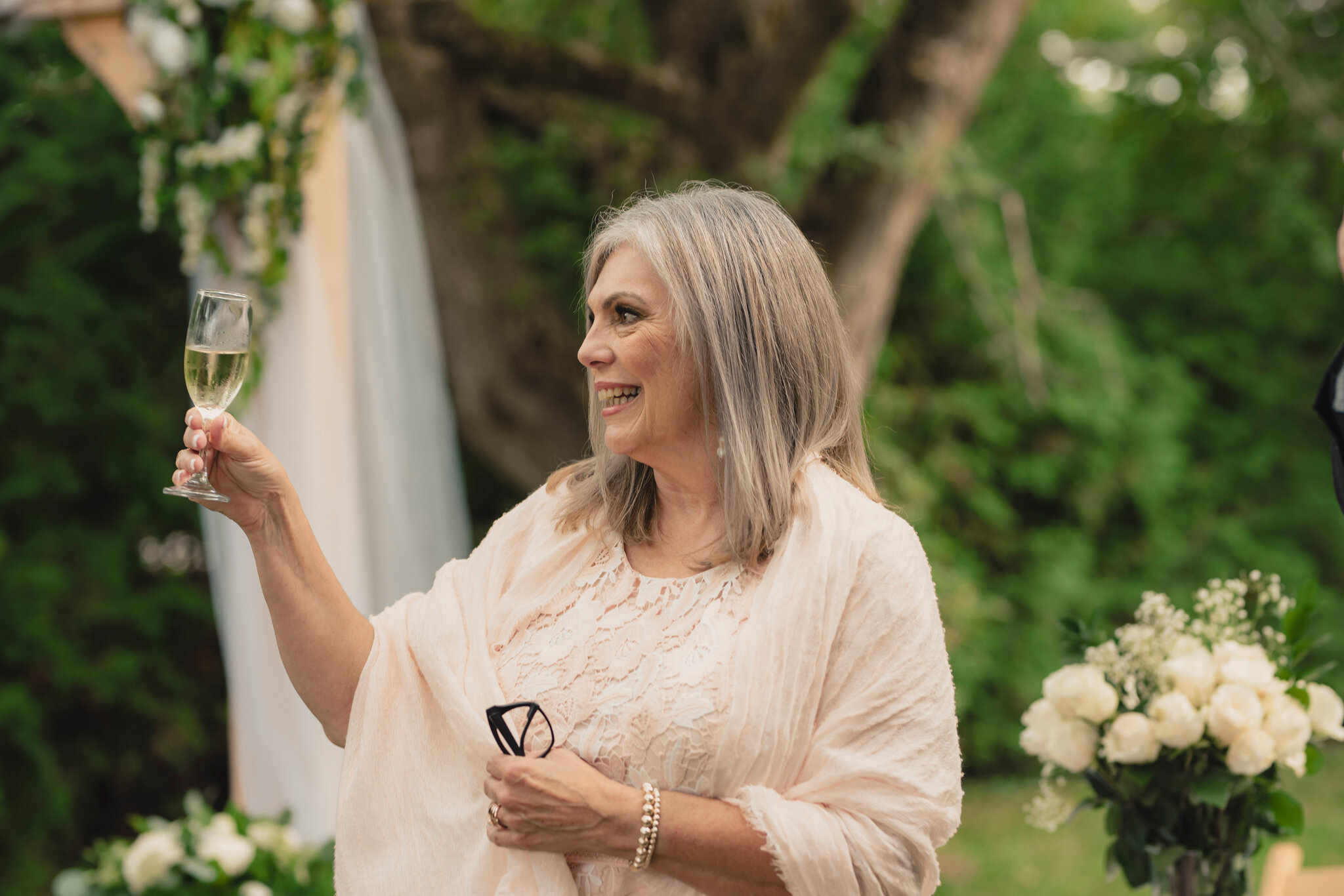 champagne toast to newlyweds at intimate backyard south georgian