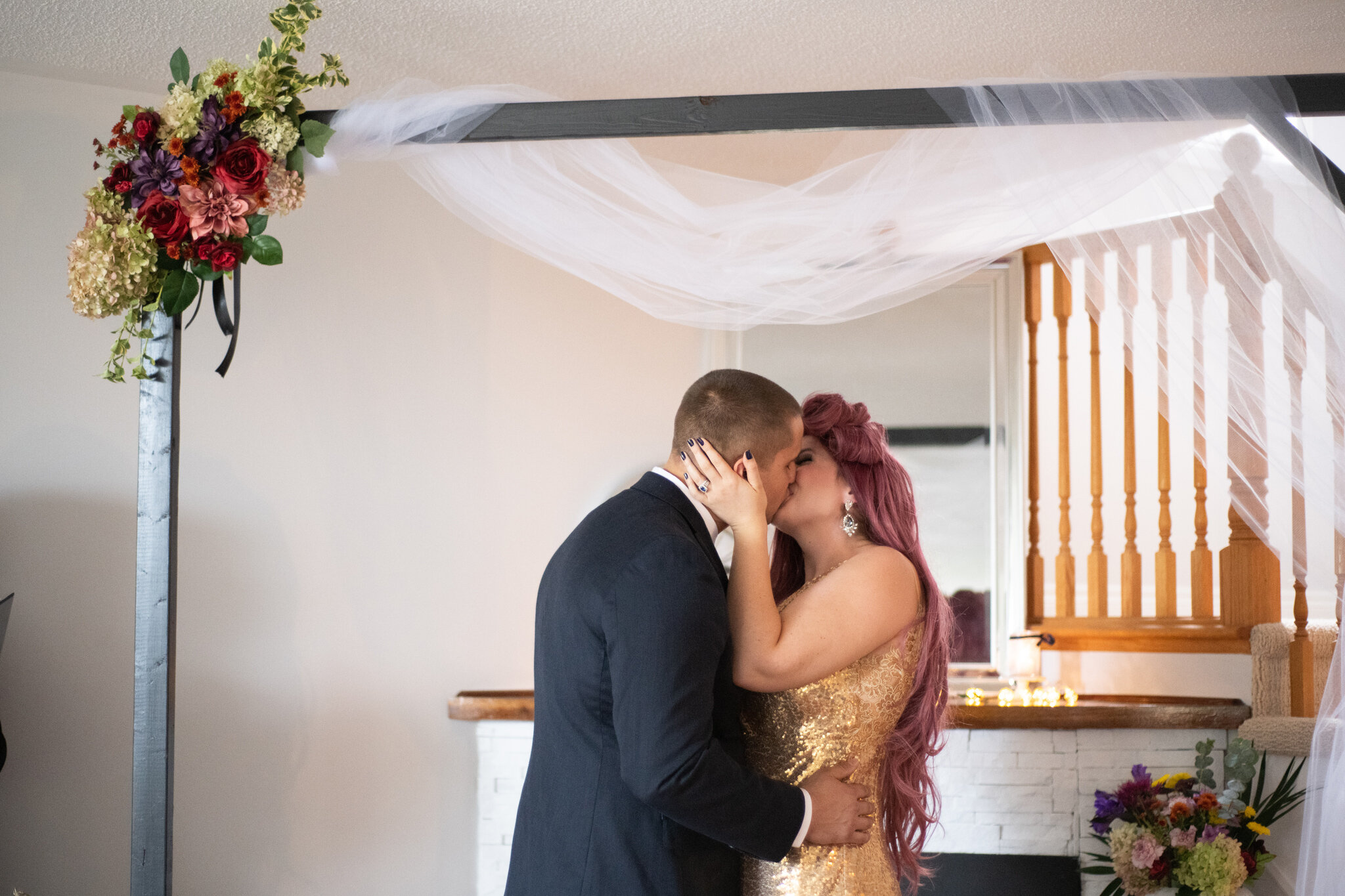 First kiss at collingwood living room microwedding ceremony