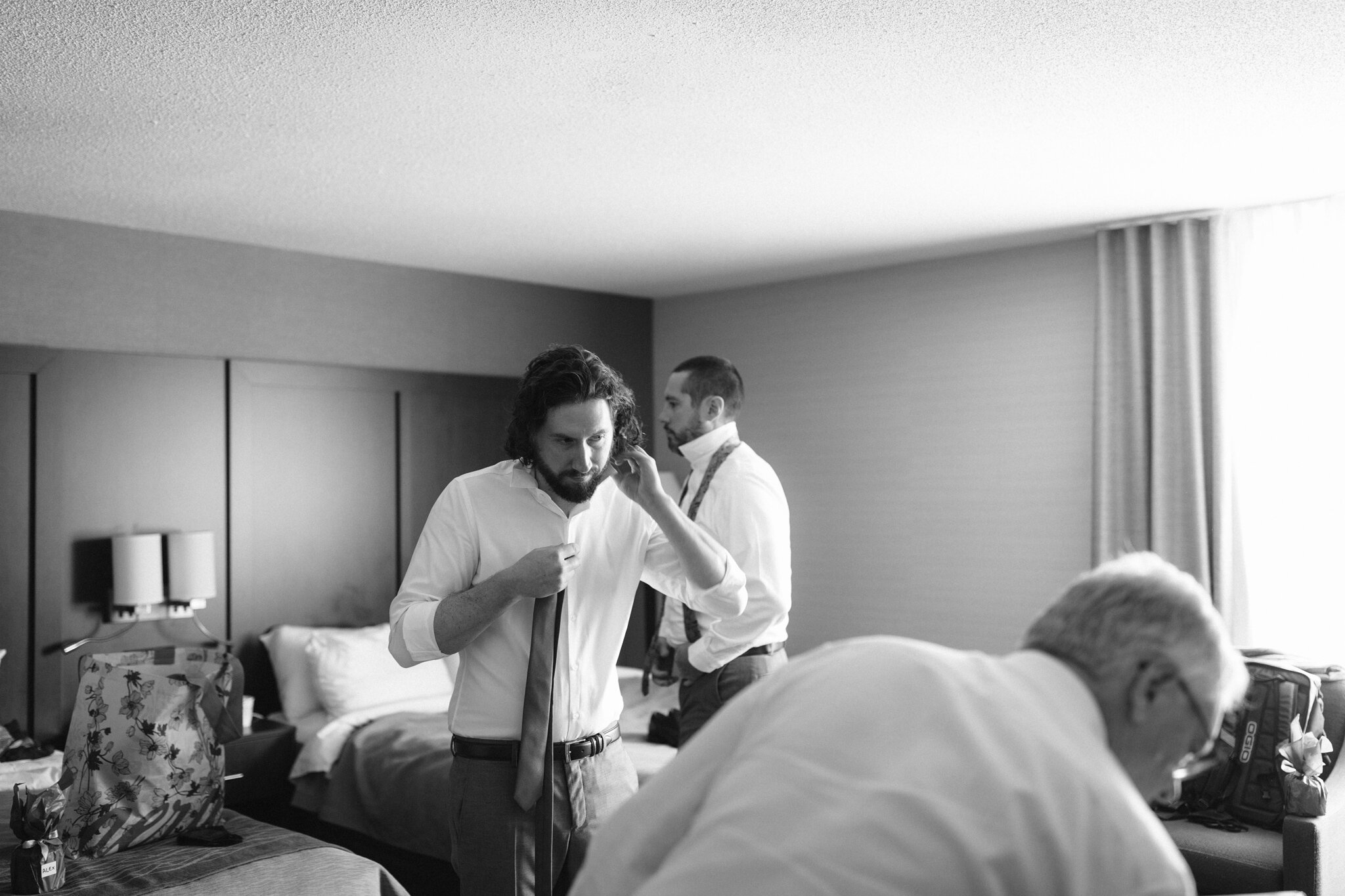 Groom getting ready with family Collingwood hotel wedding