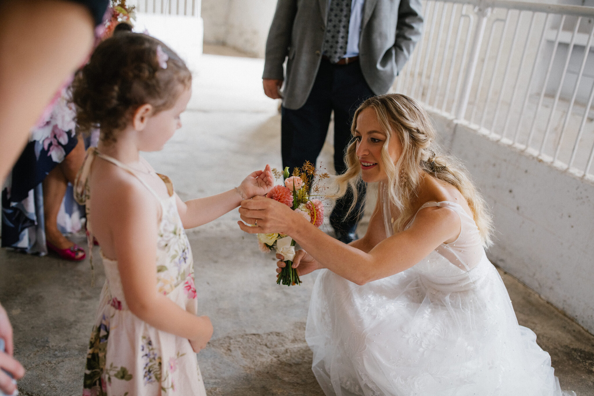 Bride with flower girl Euclid Design Co. flowers