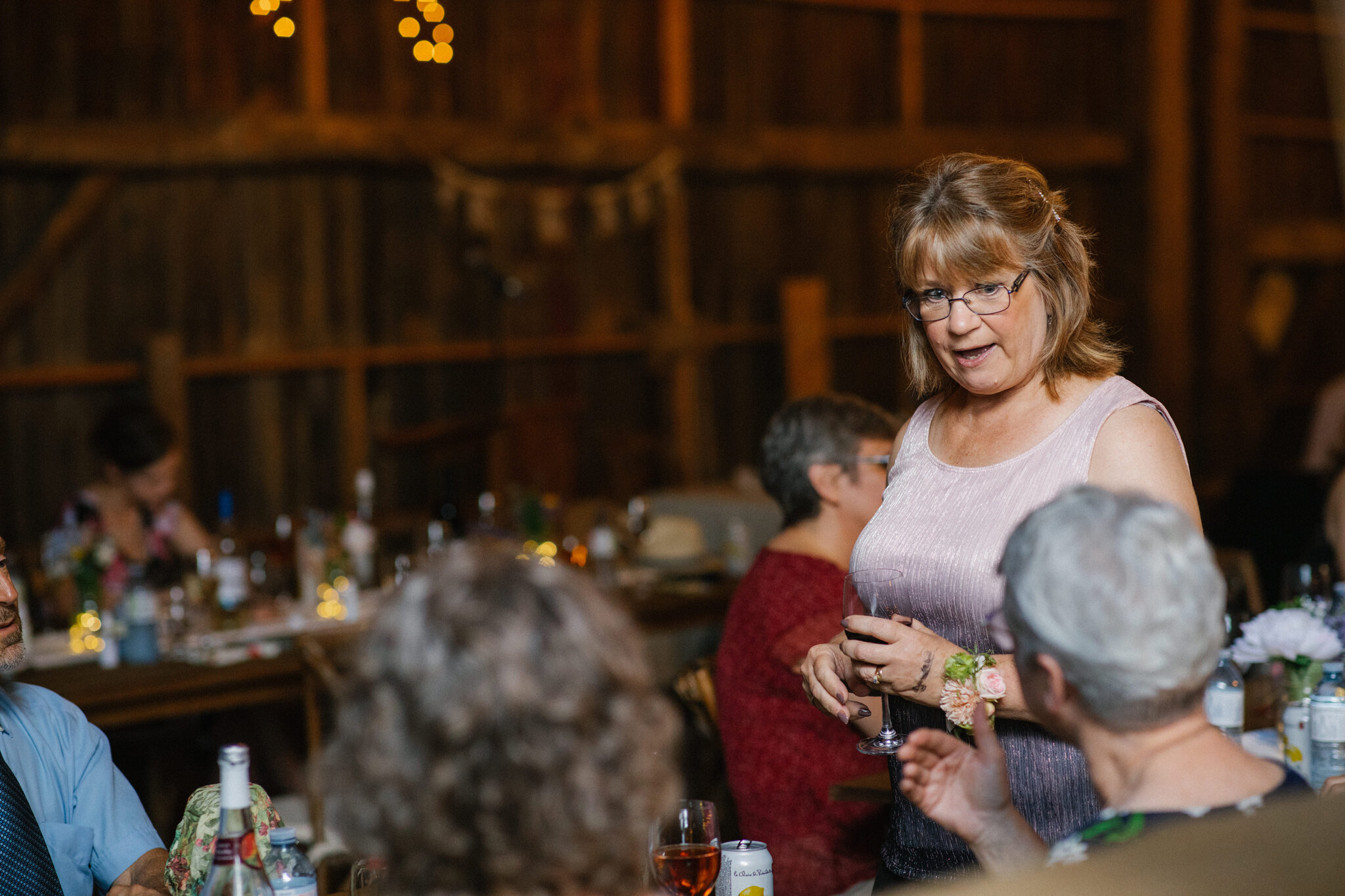 guests at meaford barn wedding twinkle lights