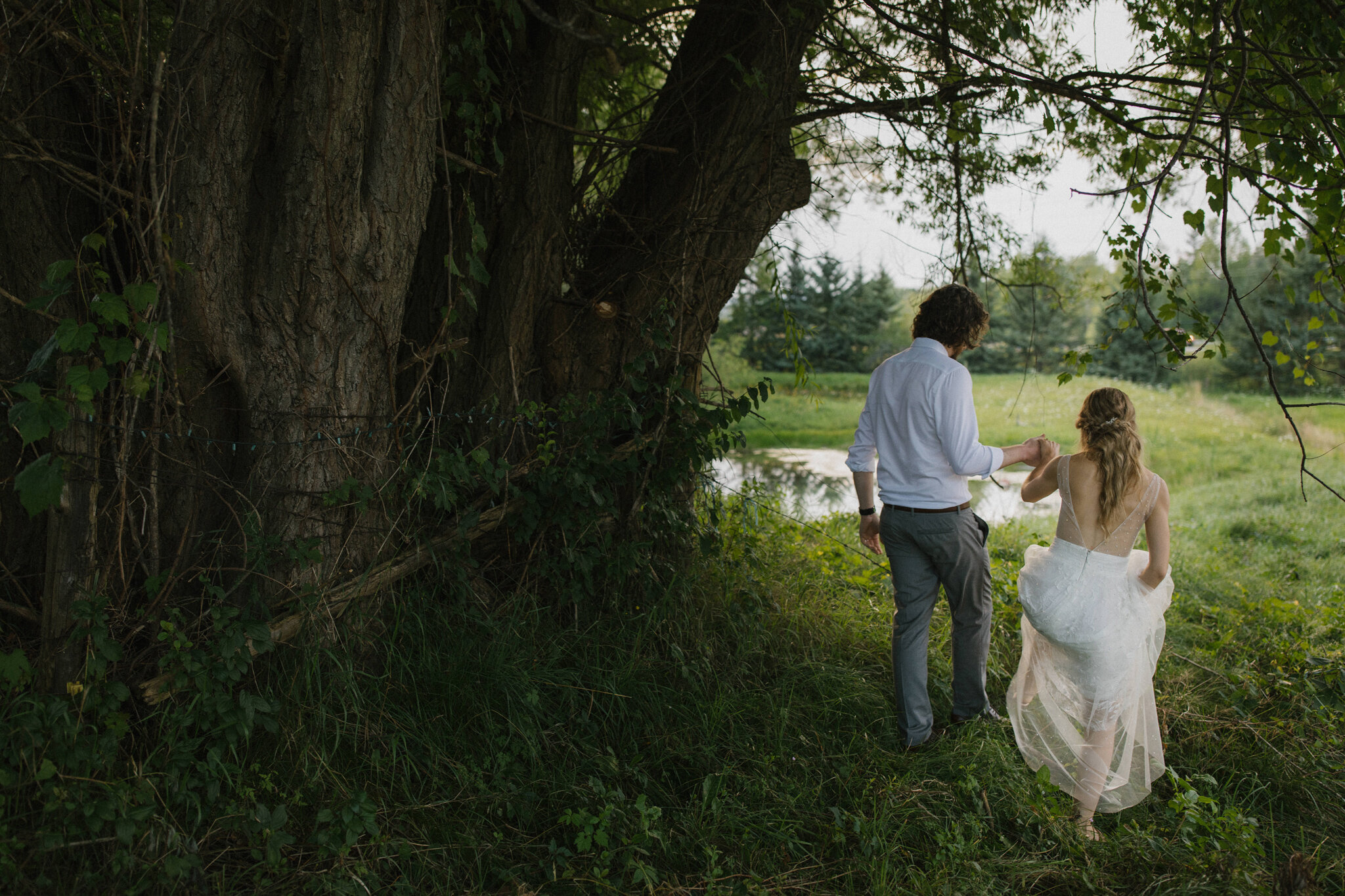 Couple walk field golden hour meaford