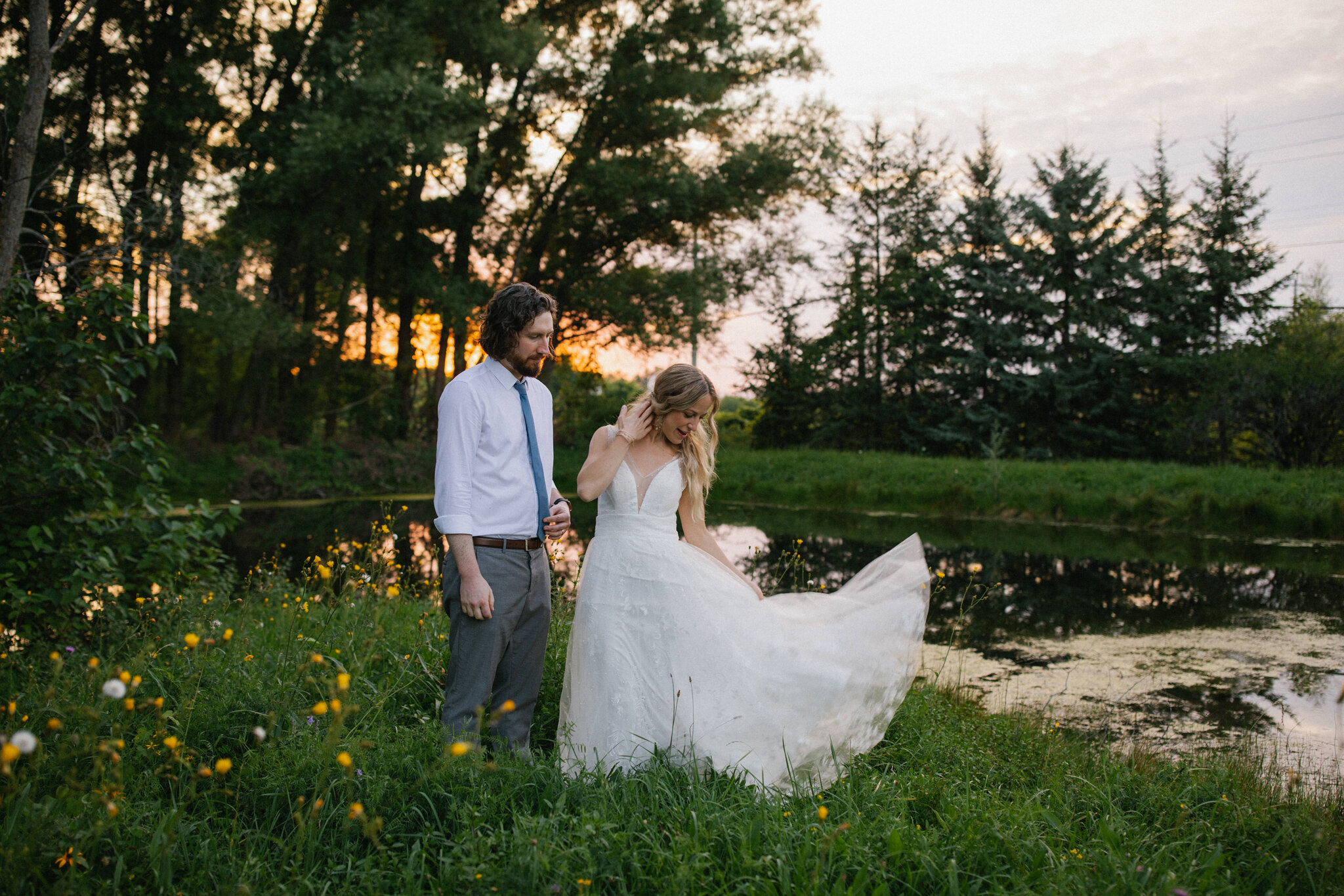 Bride swishes lace boho dress golden hour