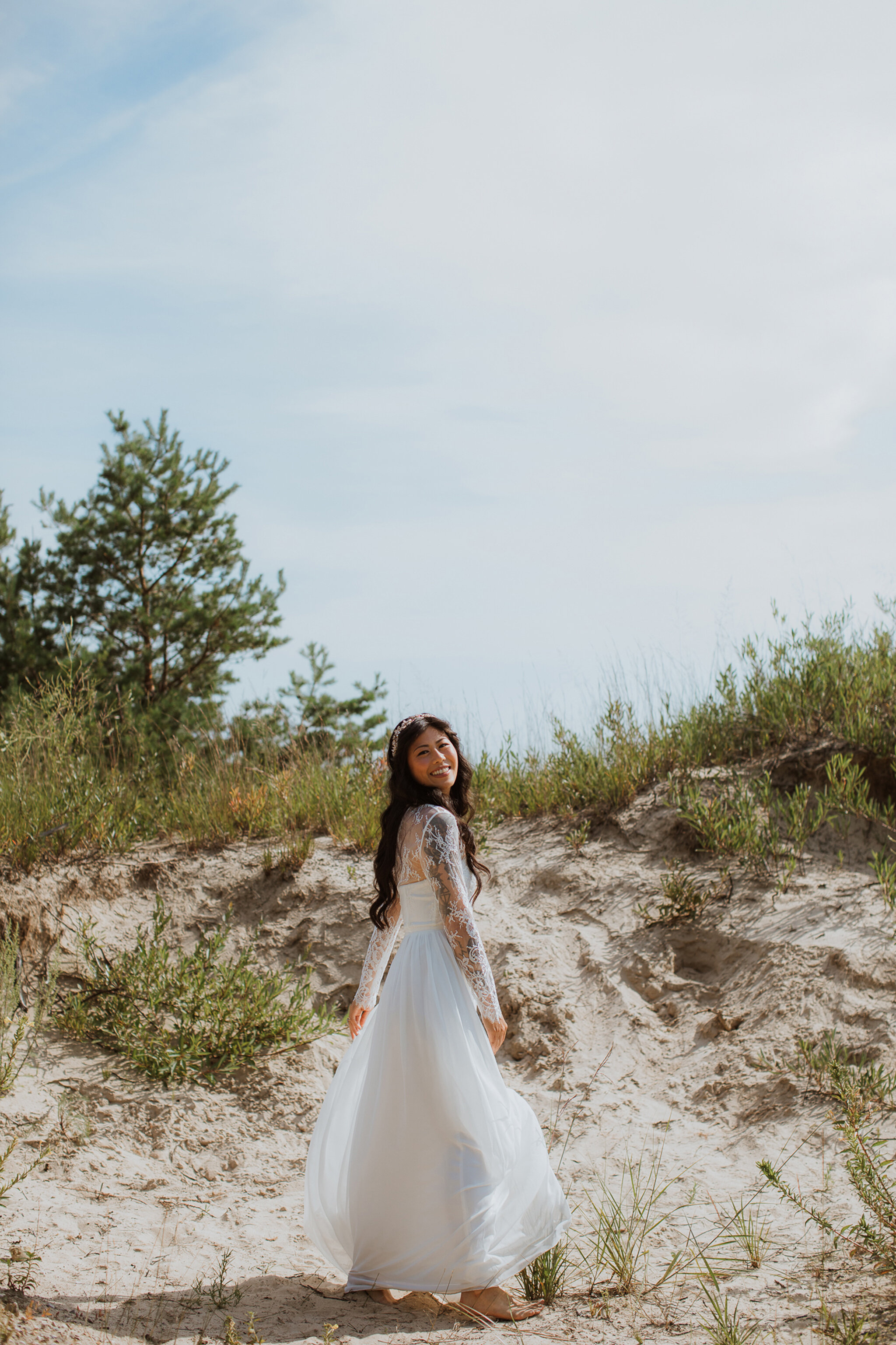 Boho bride lace wedding dress in sand dunes