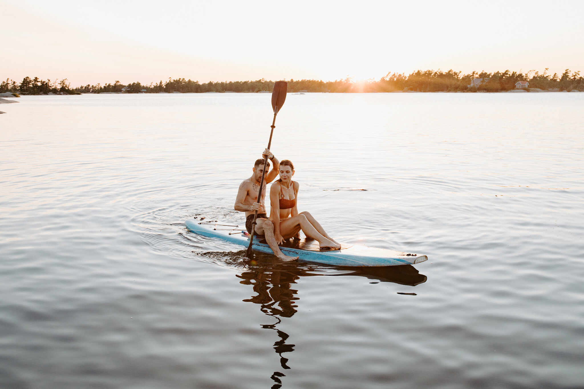 georgian bay romantic couple paddle board