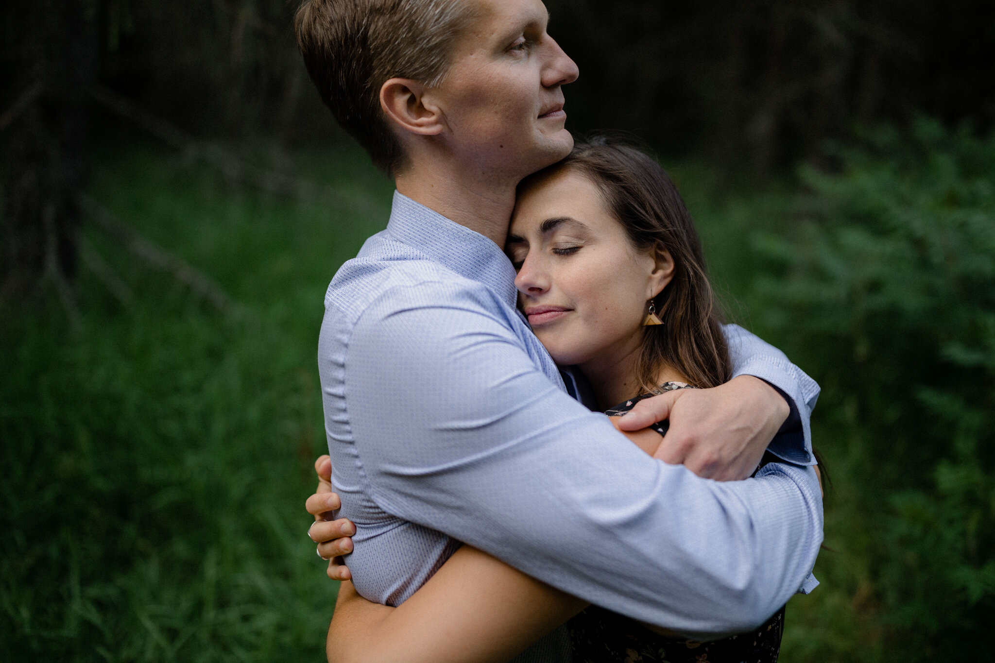 Couple hug in the woods of Beaver Valley