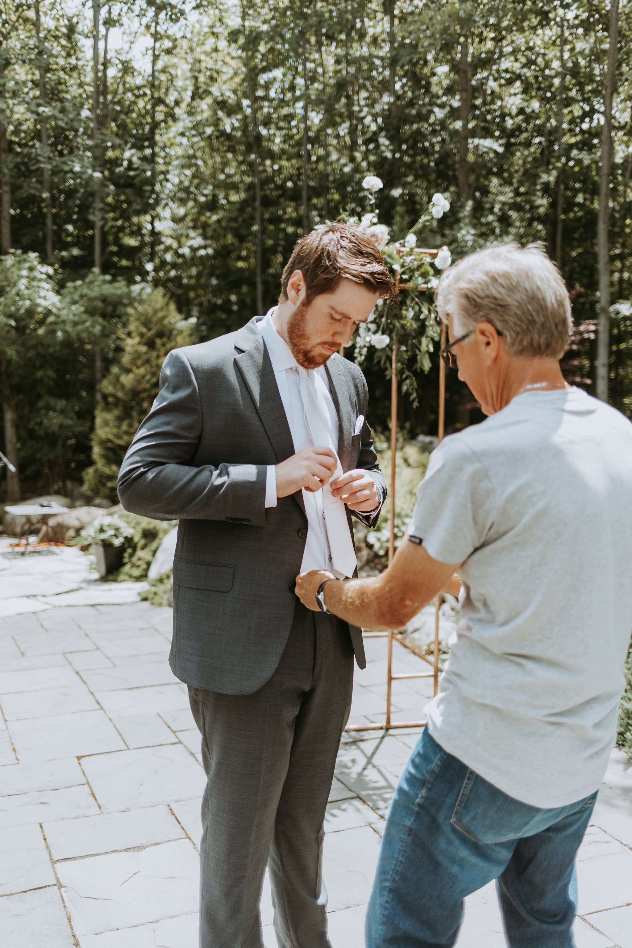 Groom gets ready for outdoor Lora Bay wedding
