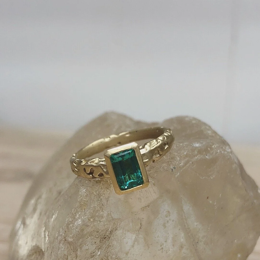 Emerald and gold engagement ring made during workshop