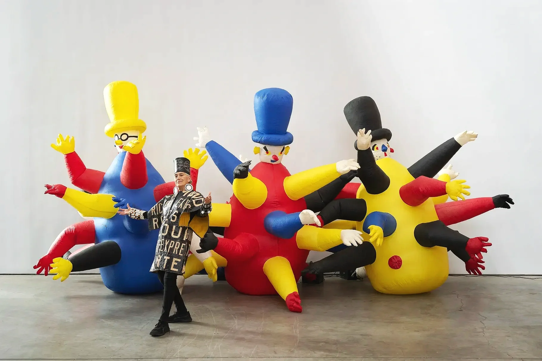 Portrait of Pat Oleszko with his work Three Bozos (1985)