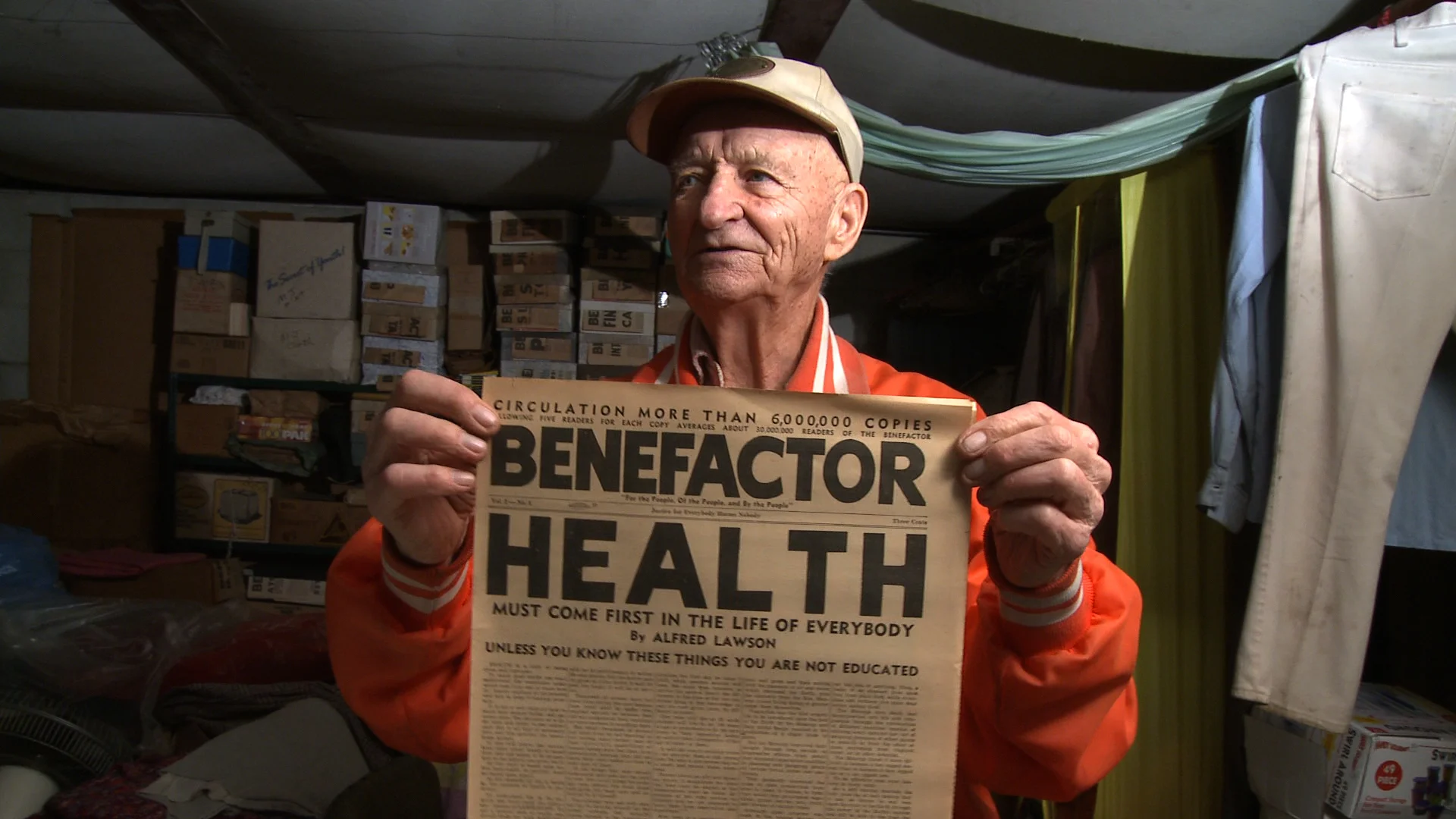 Merle holding an issue of Lawson's paper - The Benefactor