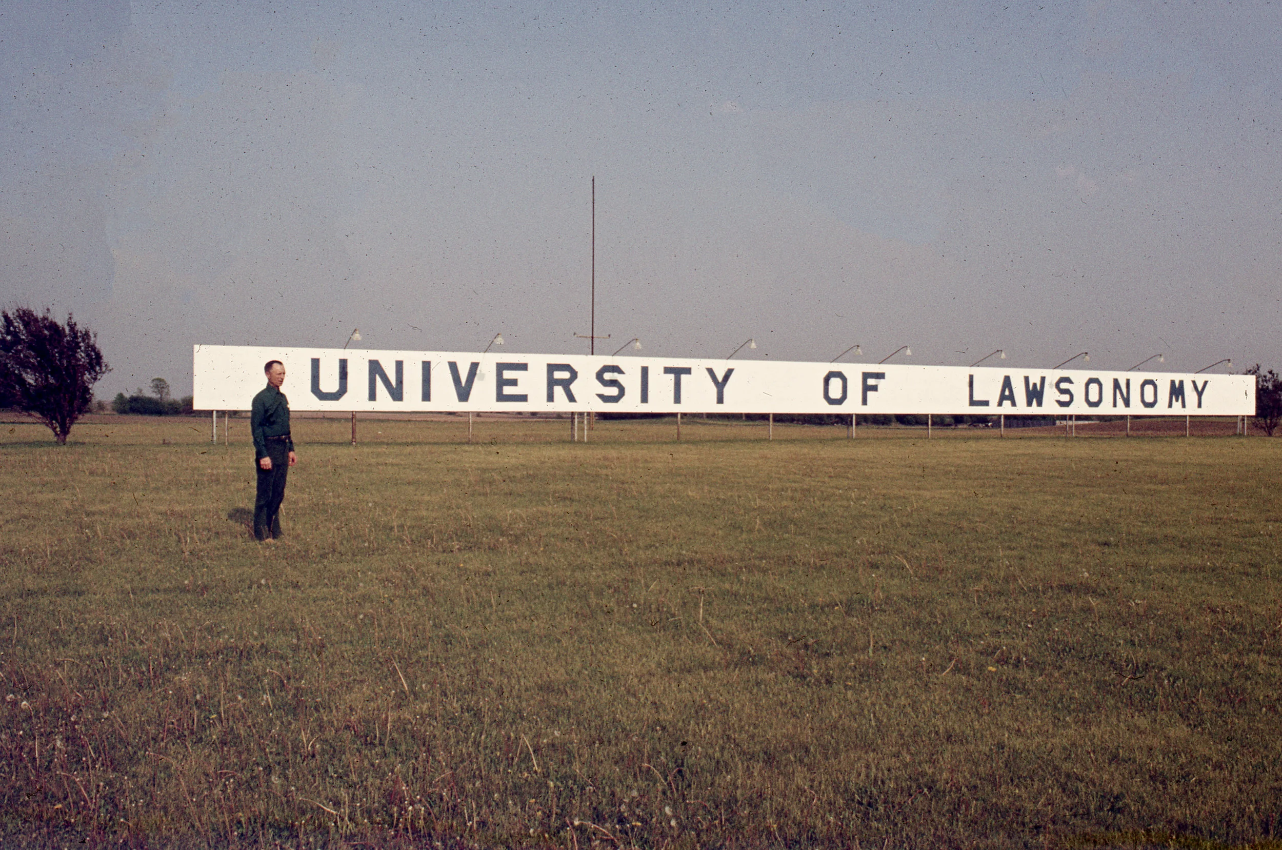 Merle beside the billboard that sat along Interstate 94 between Milwaukee and Chicago.