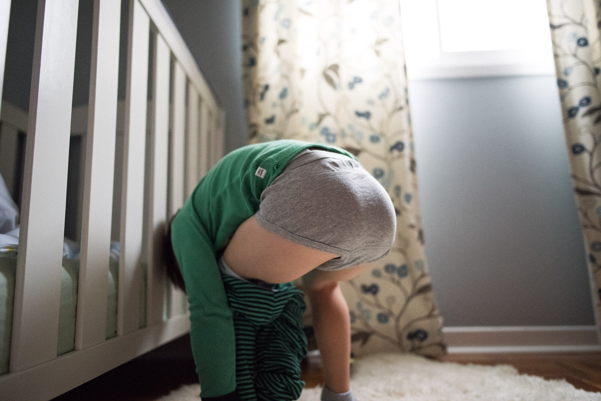 boy is stuck while taking off his pants