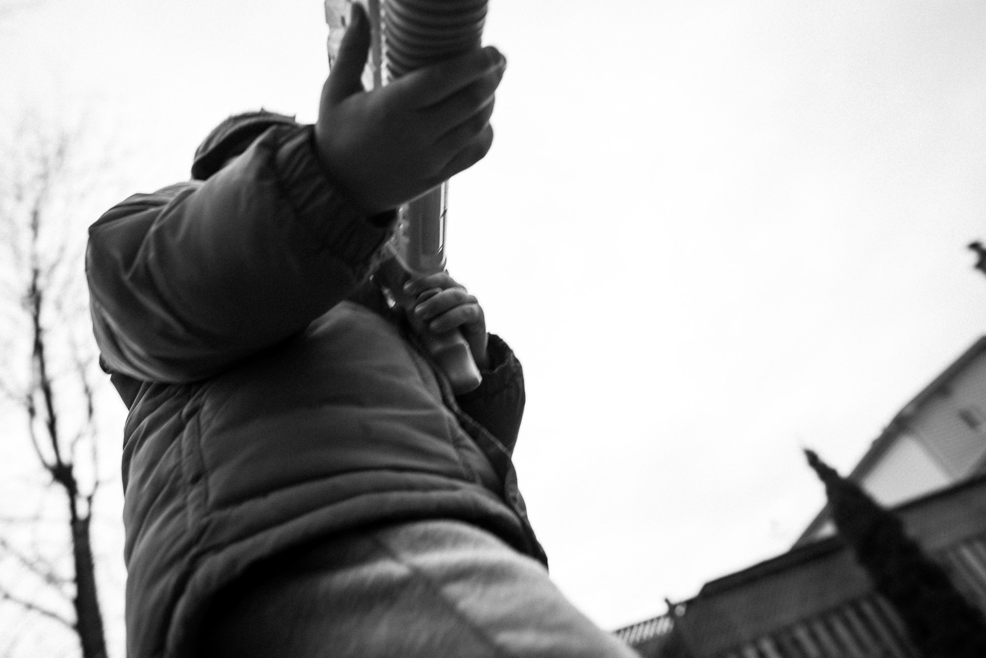 low shot of boy holding a water gun