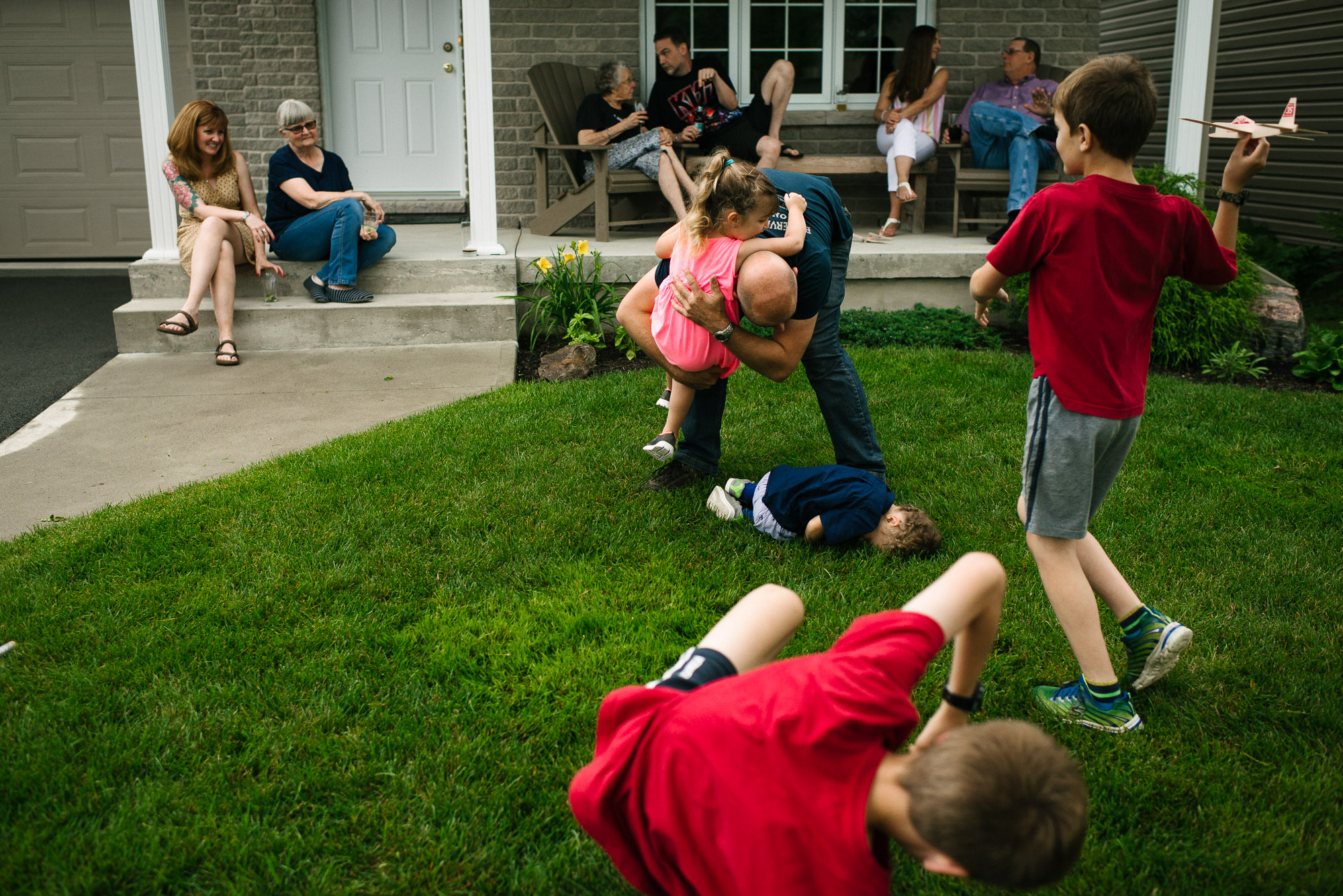 family spends time on the front porch