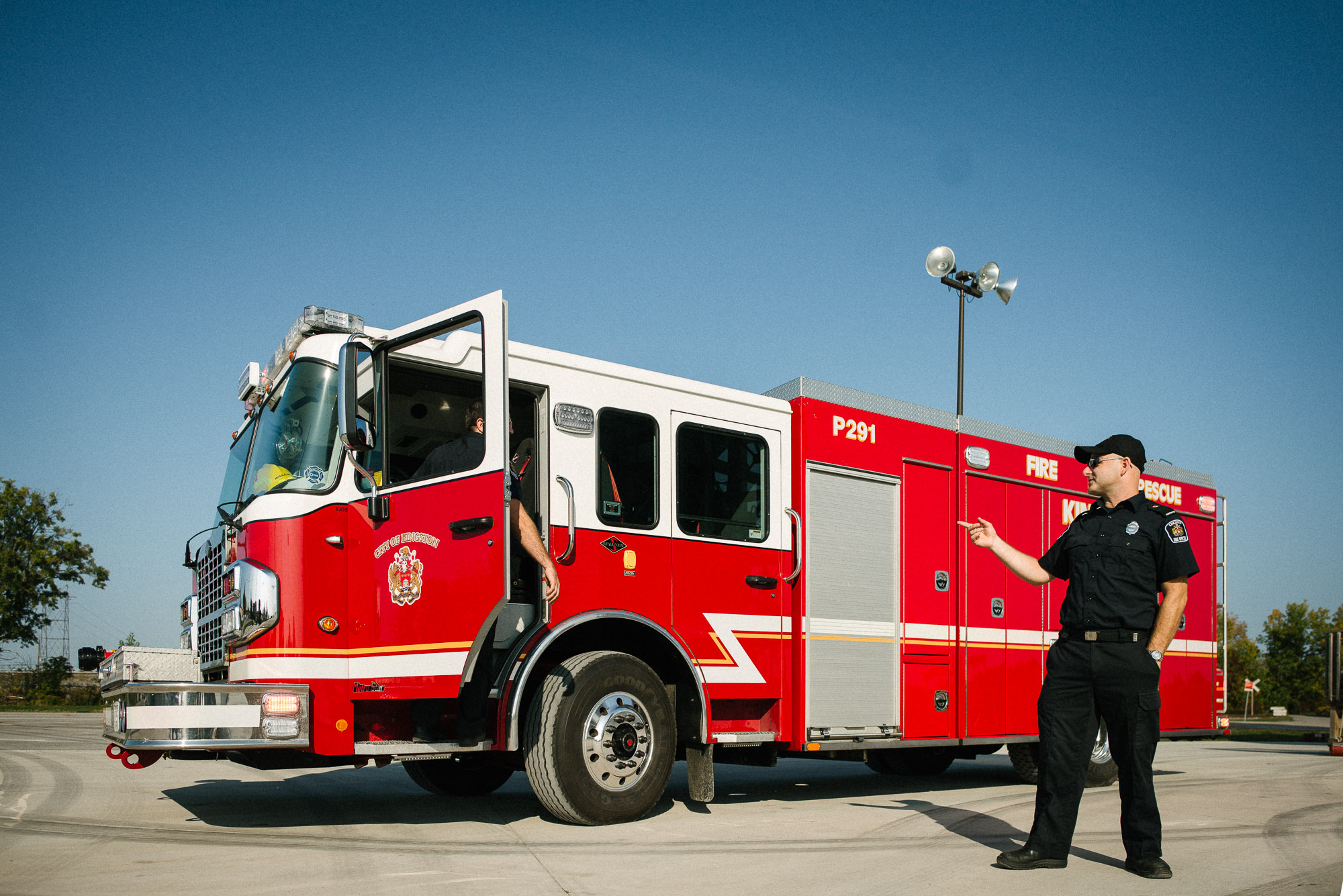 fireman stands in front of fire truck